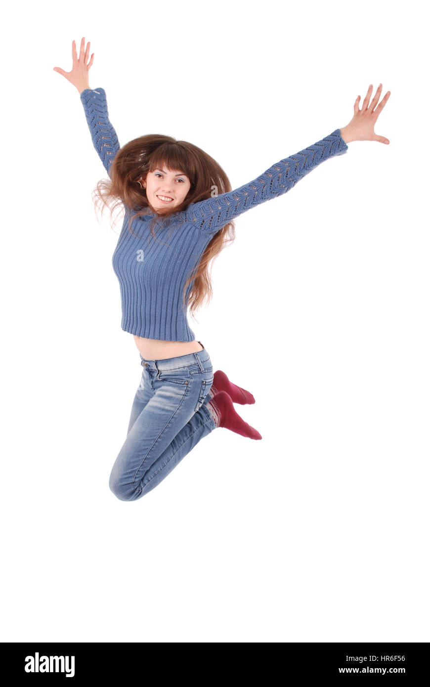 A piena lunghezza Ritratto di una ragazza allegra jumping isolato su uno sfondo bianco Foto Stock