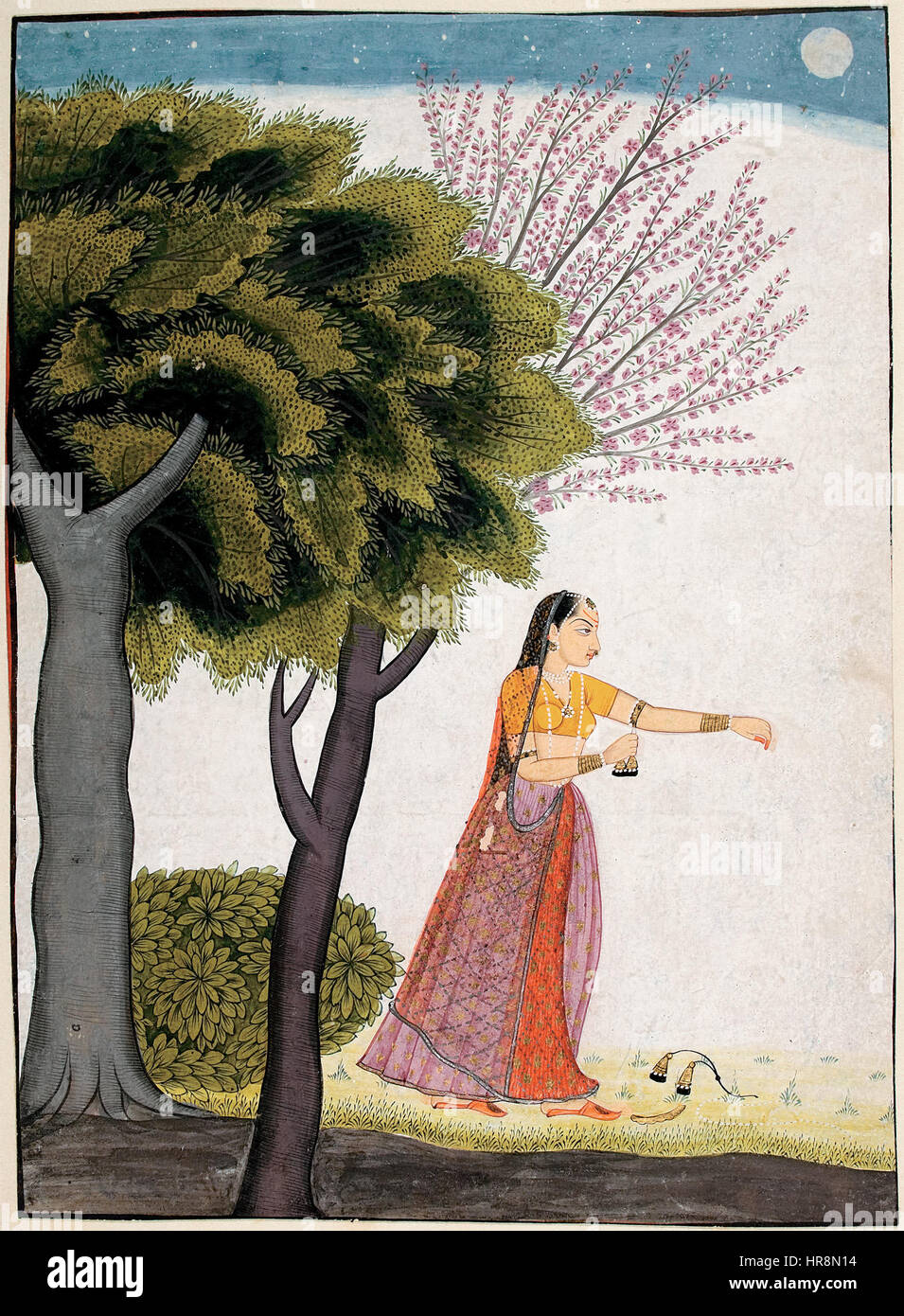 "Vipralabdha Nayika" è un tema classico nell'arte indiana che raffigura una donna separata dal suo amante, spesso caratterizzata dal suo dolore emotivo. Il dipinto ritrae la narrazione tradizionale del desiderio e dell'abbandono, con la donna che esprime dolore mentre attende la sua amata. Questo tema è comunemente visto nella pittura e nella scultura in miniatura indiana, simboleggiando l'amore non corrisposto e il dolore emotivo. Foto Stock