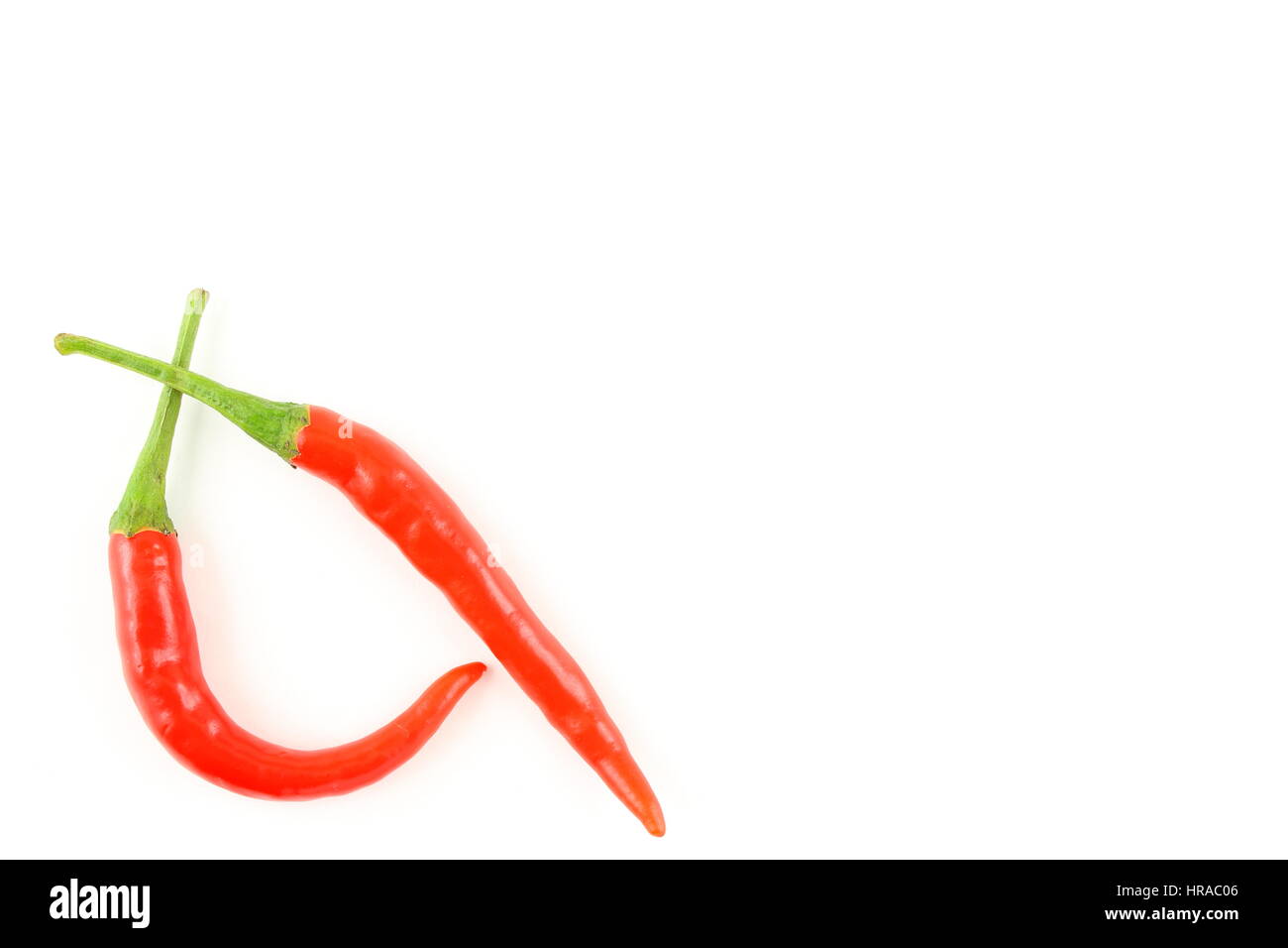 Fresh Thai Chilli peppers isolato su uno sfondo bianco come un cibo texture di sfondo Foto Stock