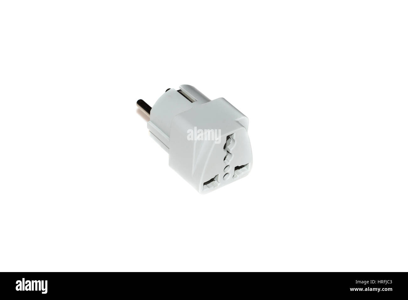 Close up universal American, Regno Unito alla Comunità di viaggio convertitore adattatore spina. Oggetto isolato su sfondo bianco Foto Stock