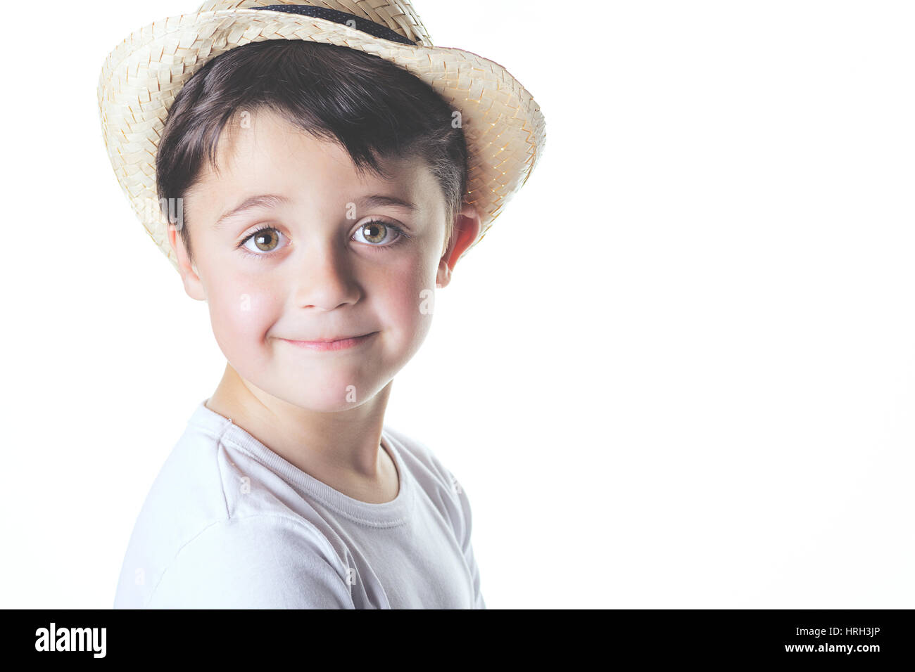 Bambino felice con hat guarda la fotocamera Foto Stock