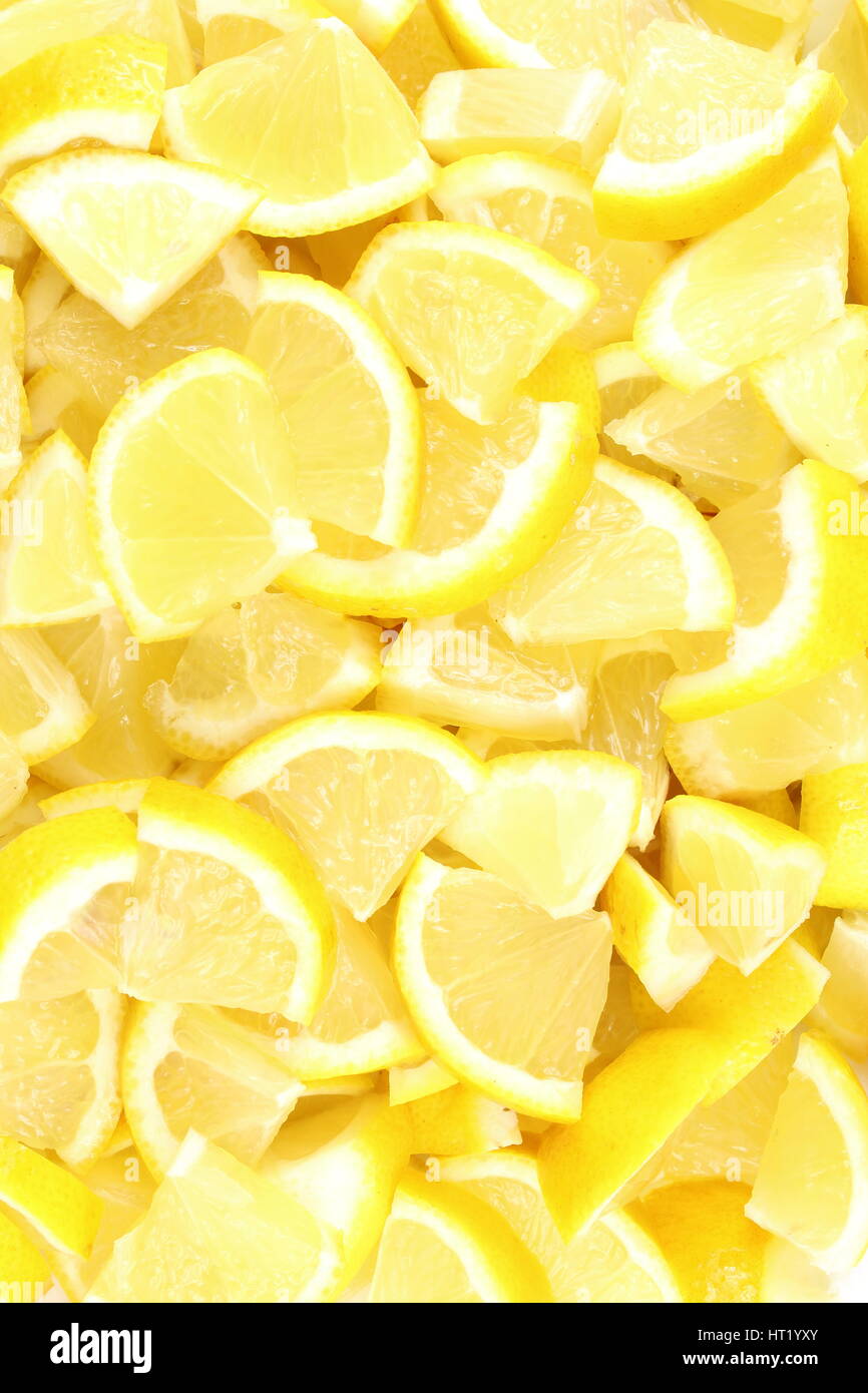 Pezzi di limone fresco frutta closeup come un cibo texture di sfondo Foto Stock