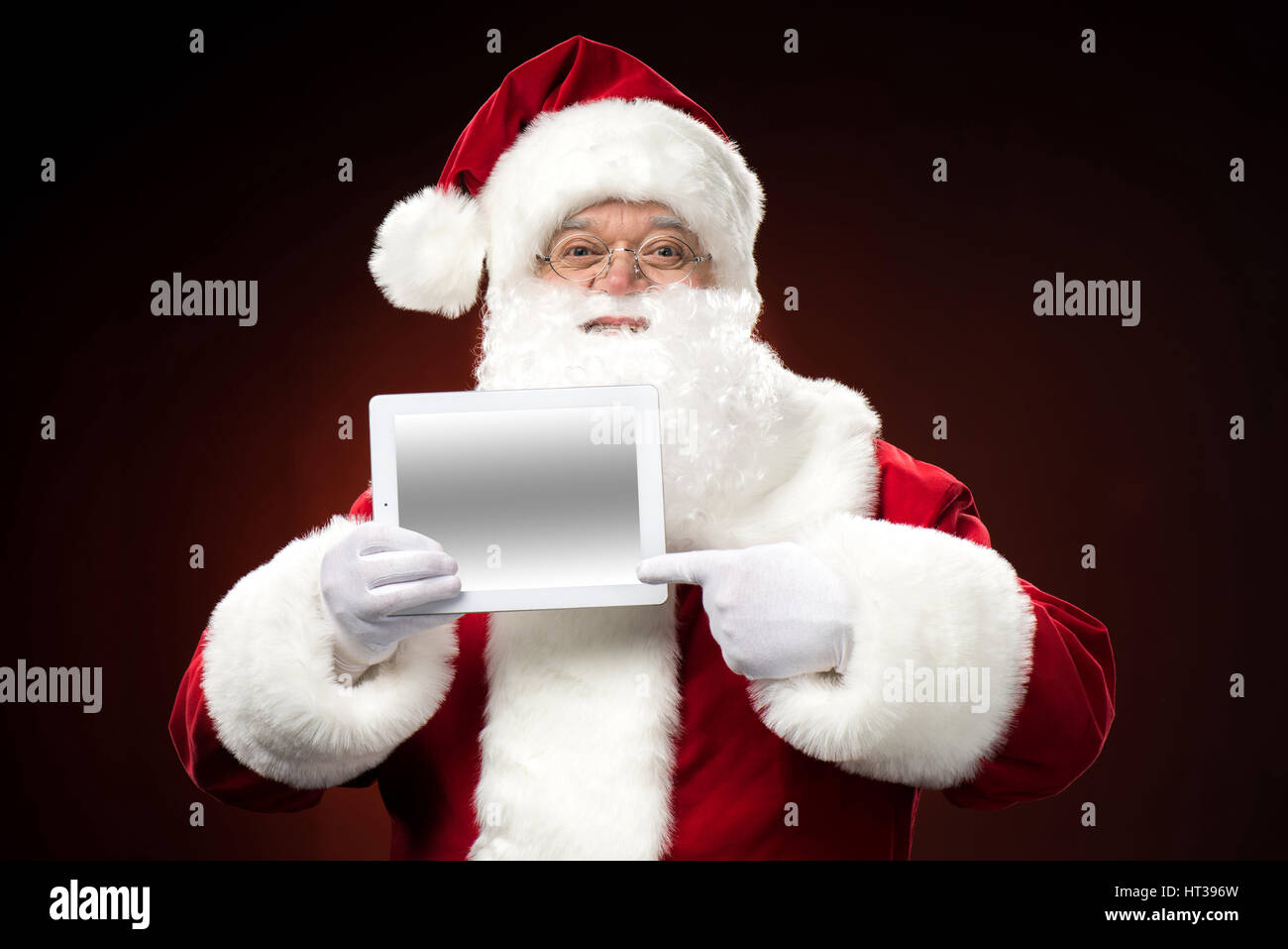 Babbo Natale con la tavoletta digitale Foto Stock