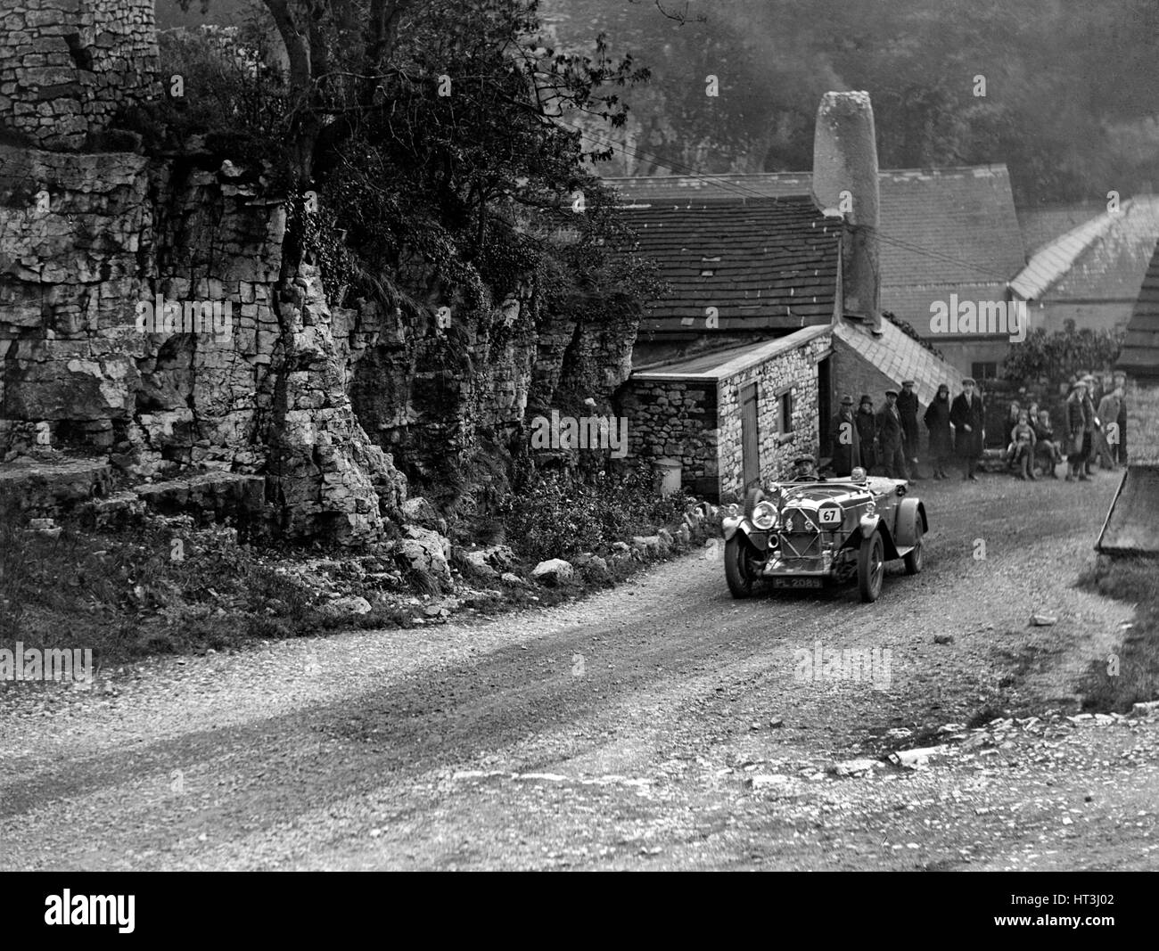 Lagonda del signore de Clifford competere nel MCC Sporting prova, Litton lasco, Derbyshire, 1930. Artista: Bill Brunell. Foto Stock