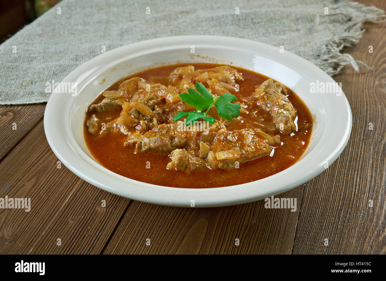 Sarapatel - cucina Goan. carne di maiale cotto a vapore del pane di noce di cocco Foto Stock