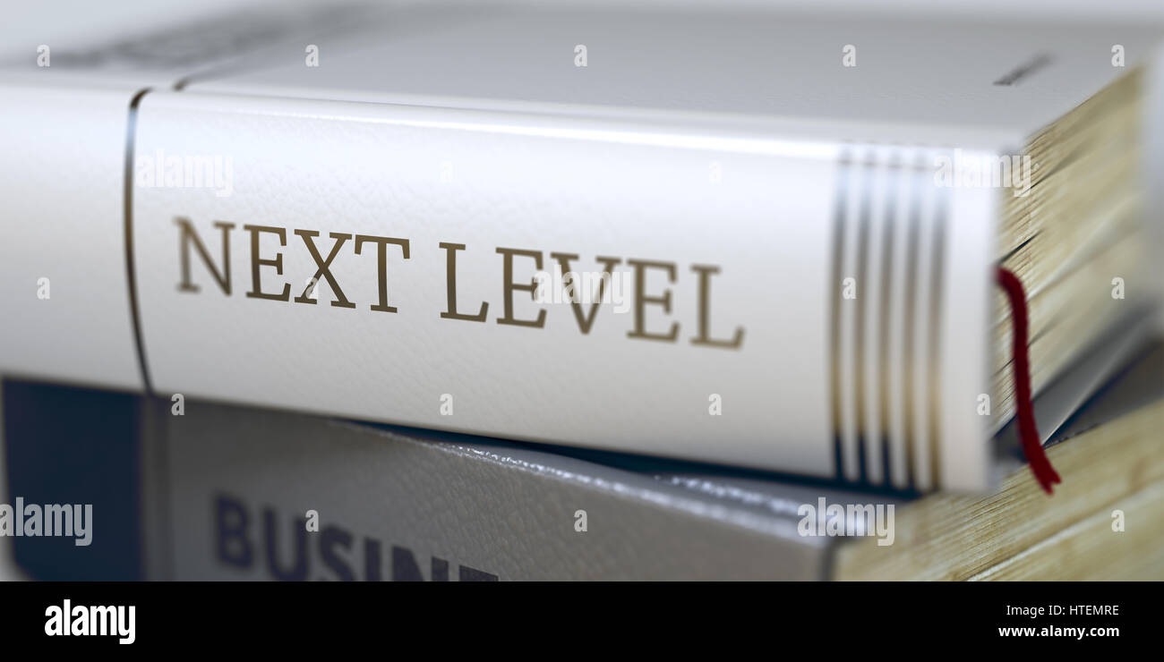Livello successivo - Business prenota il titolo. Prenota in pila con il titolo sul dorso del livello successivo. Livello successivo - prenota il titolo. Immagine sfocata con il fuoco selettivo Foto Stock