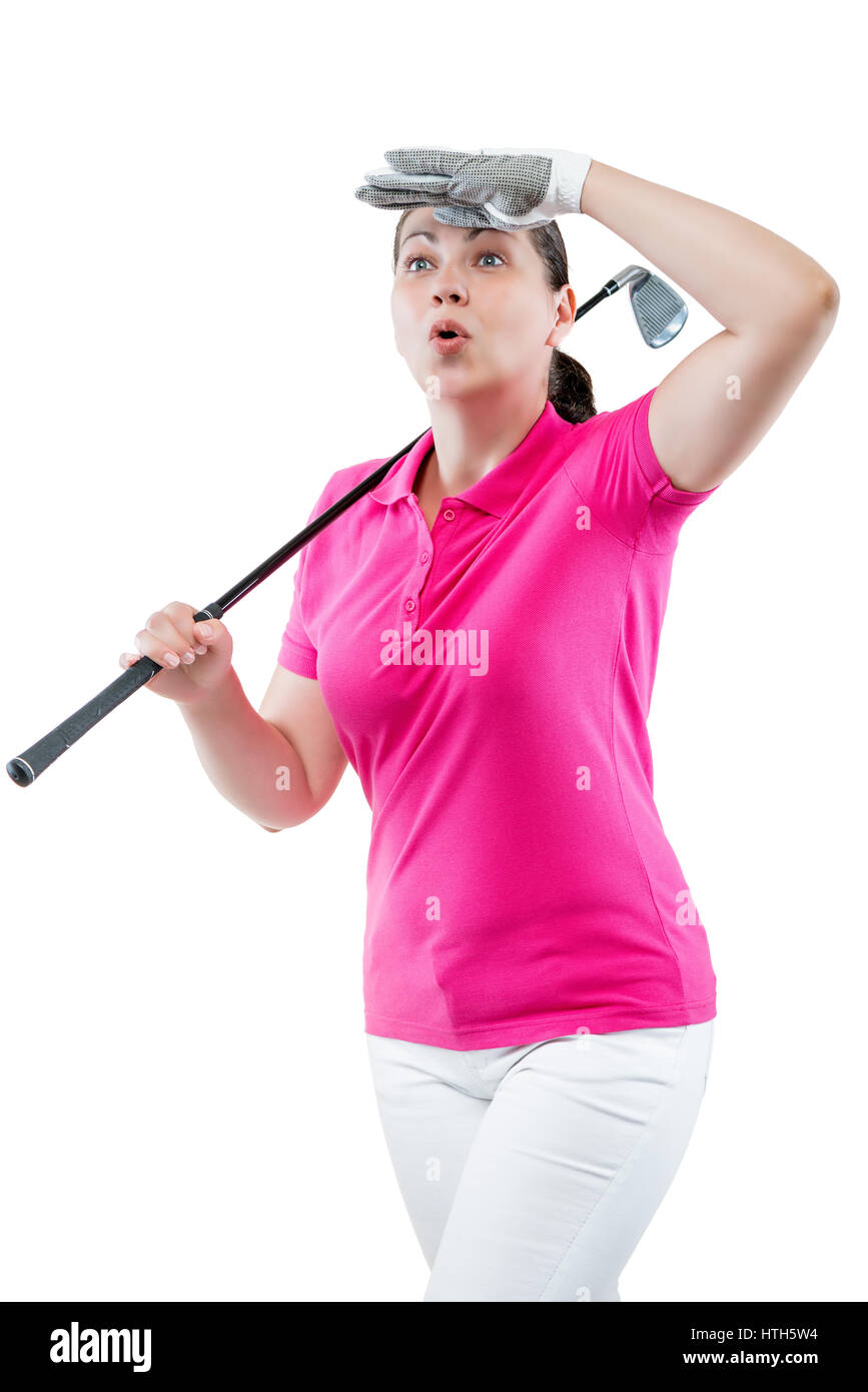 Atleta donna guardare la pallina la traiettoria di volo di golf su uno sfondo bianco Foto Stock