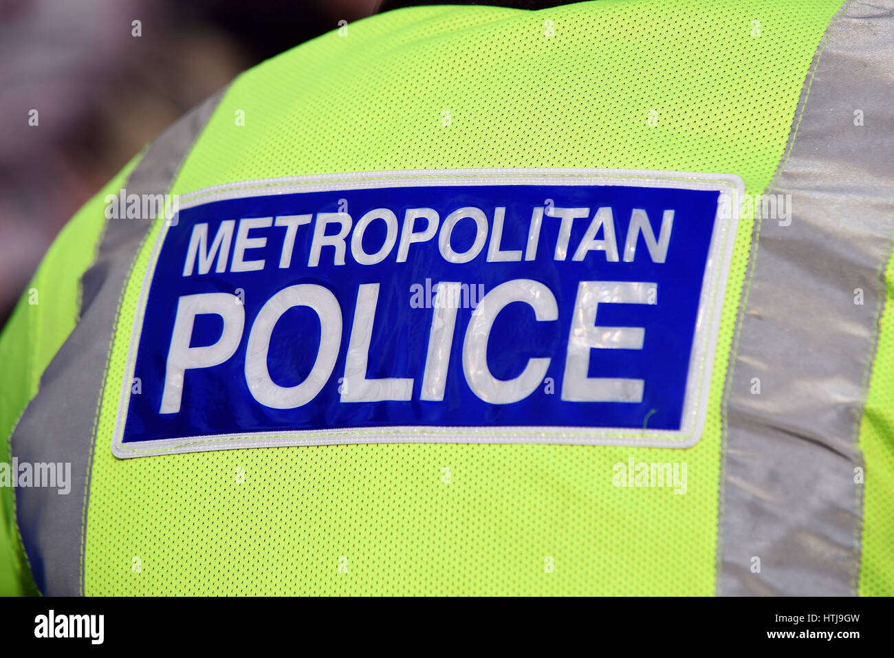 La Metropolitan Police hi-viz giacca e lettering riflettente Foto Stock