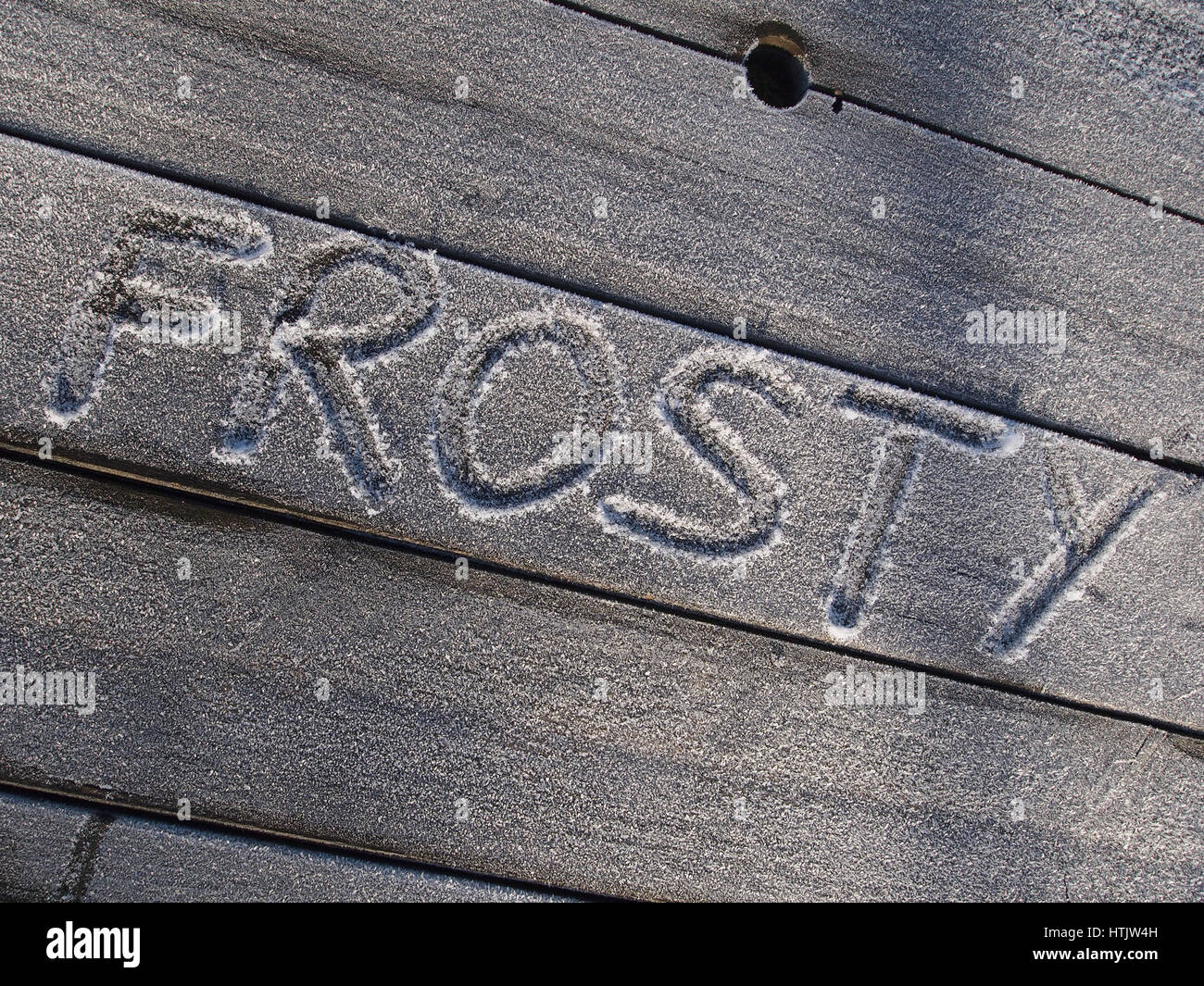 Frosty banco con parola Frosty scritto su di esso con un dito Foto Stock