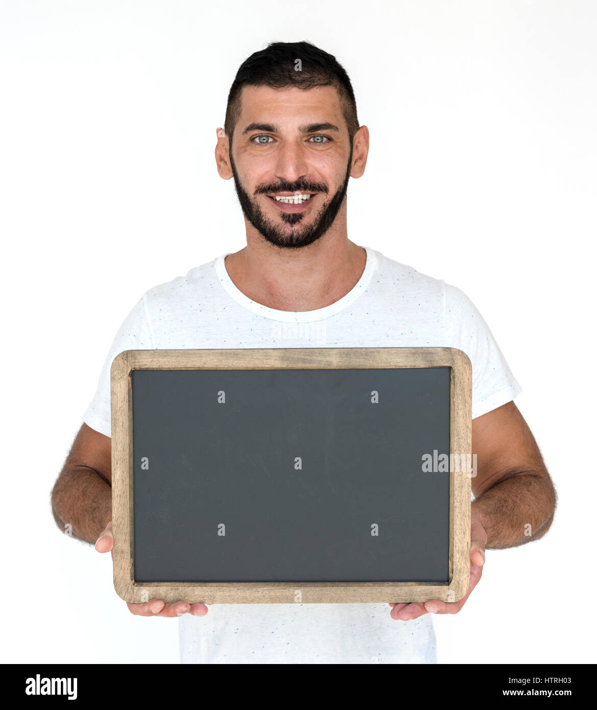 Medio Oriente Uomo sorridente felicità Holding Blackboard ritratto in studio Foto Stock