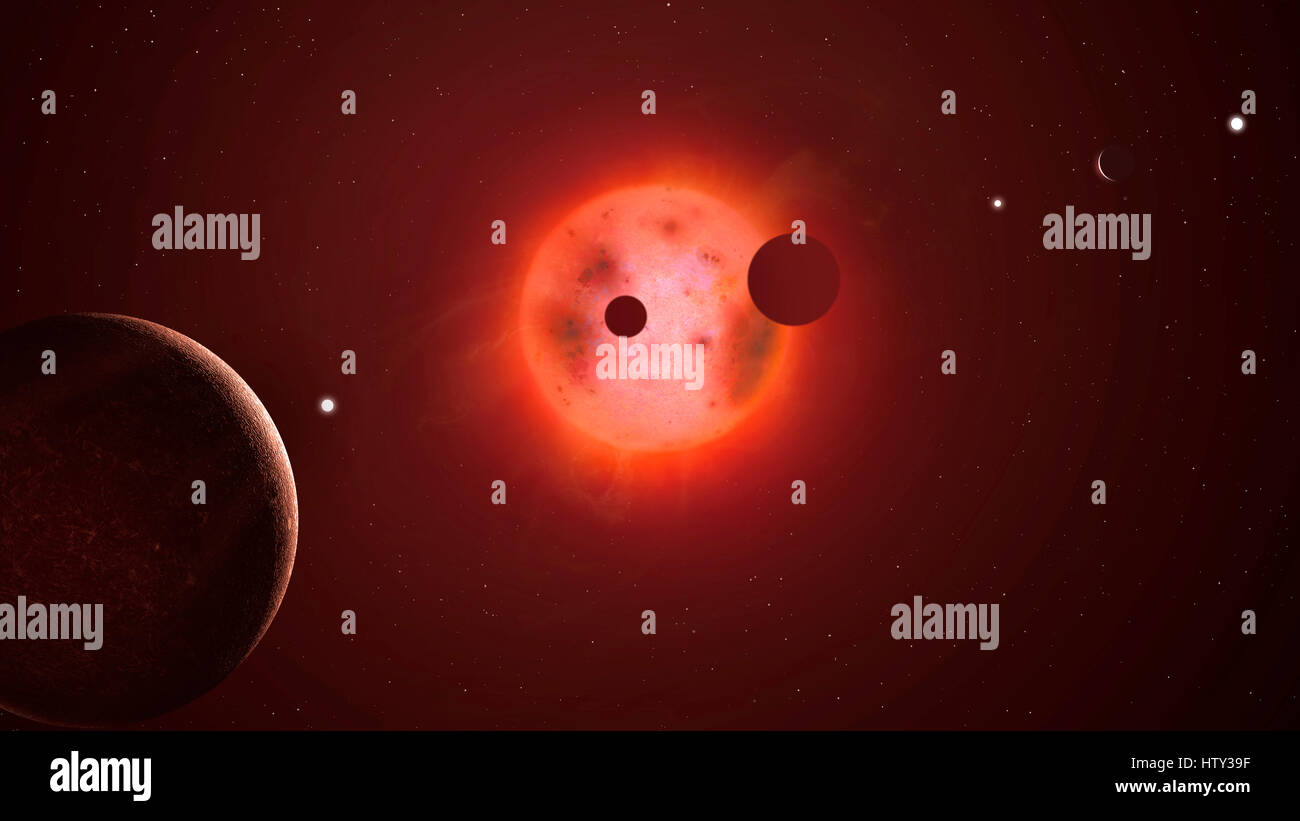 Trappiste-1 è un rosso-nano stella - la varietà più comune - si trova una quarantina di anni luce di distanza in acquario. Nel 2015, gli astronomi hanno scoperto che Trappist Foto Stock