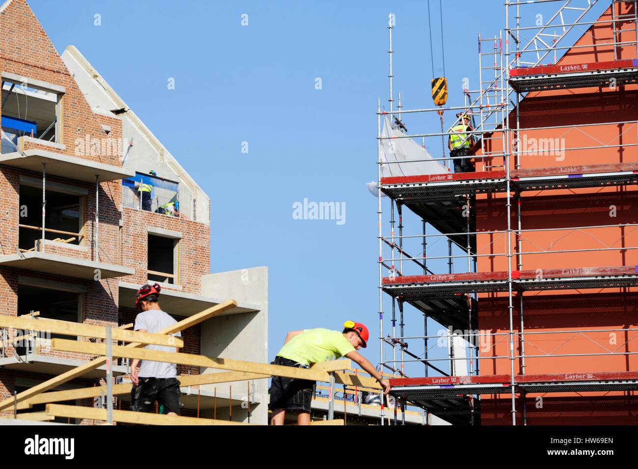 Lavoratori edili sul sito. Foto Stock