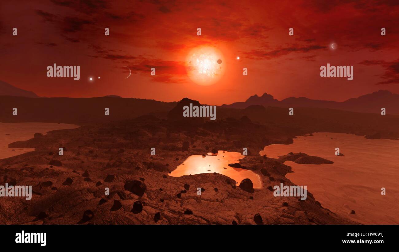 Trappiste-1 è rosso-stella nana ΓÇô varietà più comune ΓÇô trova una quarantina di anni luce di distanza in acquario.Nel 2015,gli astronomi hanno scoperto che Trappist-1 è stata ospite di messa a terra a tre dimensioni di pianeti.Poi è venuto sotto i riflettori di nuovo nel 2017 quando gli scienziati della NASA ha trovato un ulteriore quattro pianeti,tenendo totale Foto Stock