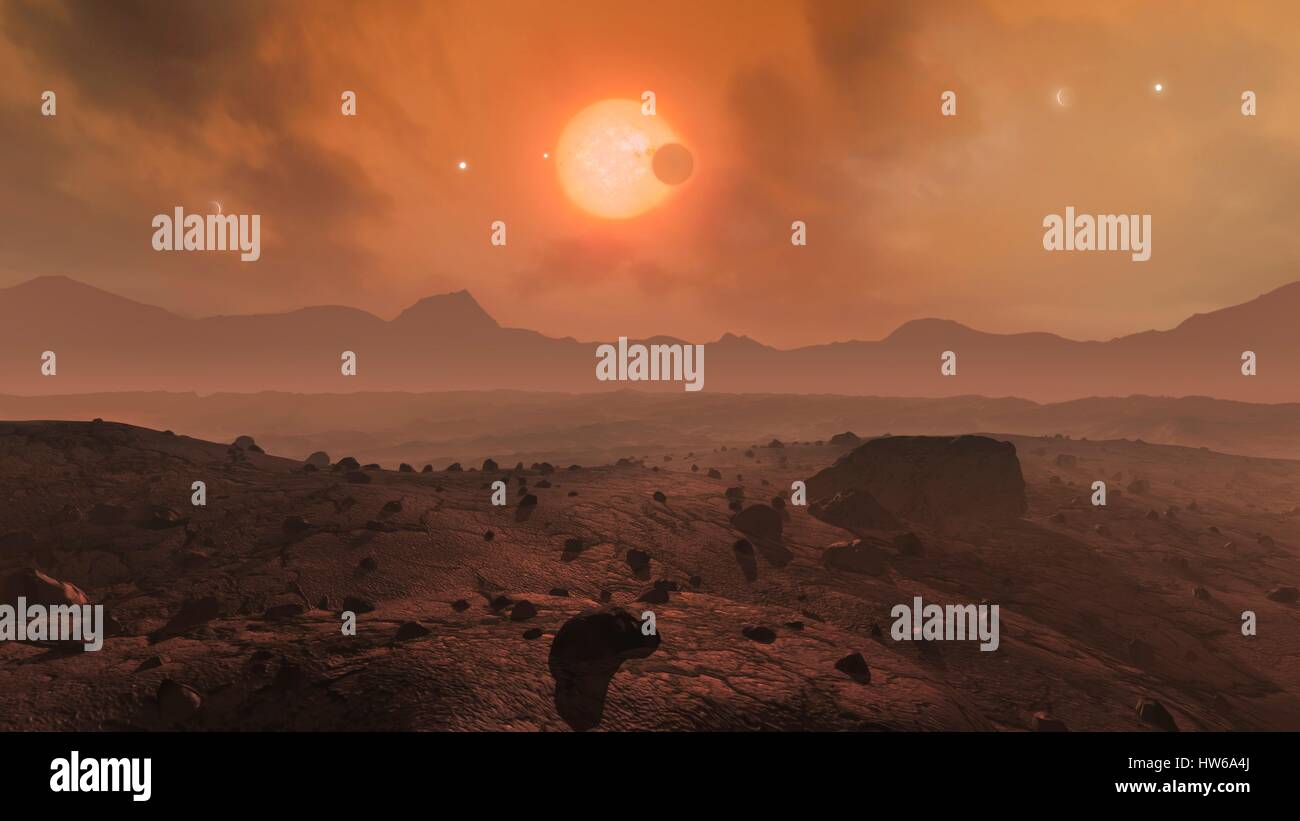 Trappiste-1 è rosso-stella nana ΓÇô varietà più comune ΓÇô trova una quarantina di anni luce di distanza in acquario.Nel 2015,gli astronomi hanno scoperto che Trappist-1 è stata ospite di messa a terra a tre dimensioni di pianeti.Poi è venuto sotto i riflettori di nuovo nel 2017 quando gli scienziati della NASA ha trovato un ulteriore quattro pianeti,tenendo totale Foto Stock