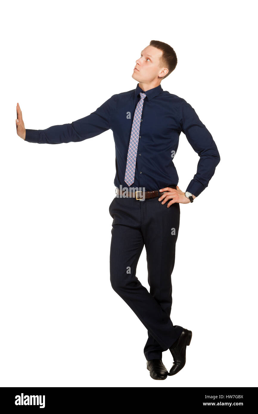 Giovane uomo in posa libera e guarda in alto, su bianco Foto Stock