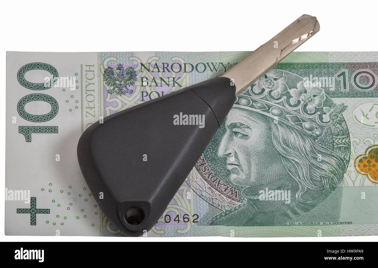 Le chiavi dell'auto sul zloty polacco banconota background closeup isolato su bianco Foto Stock