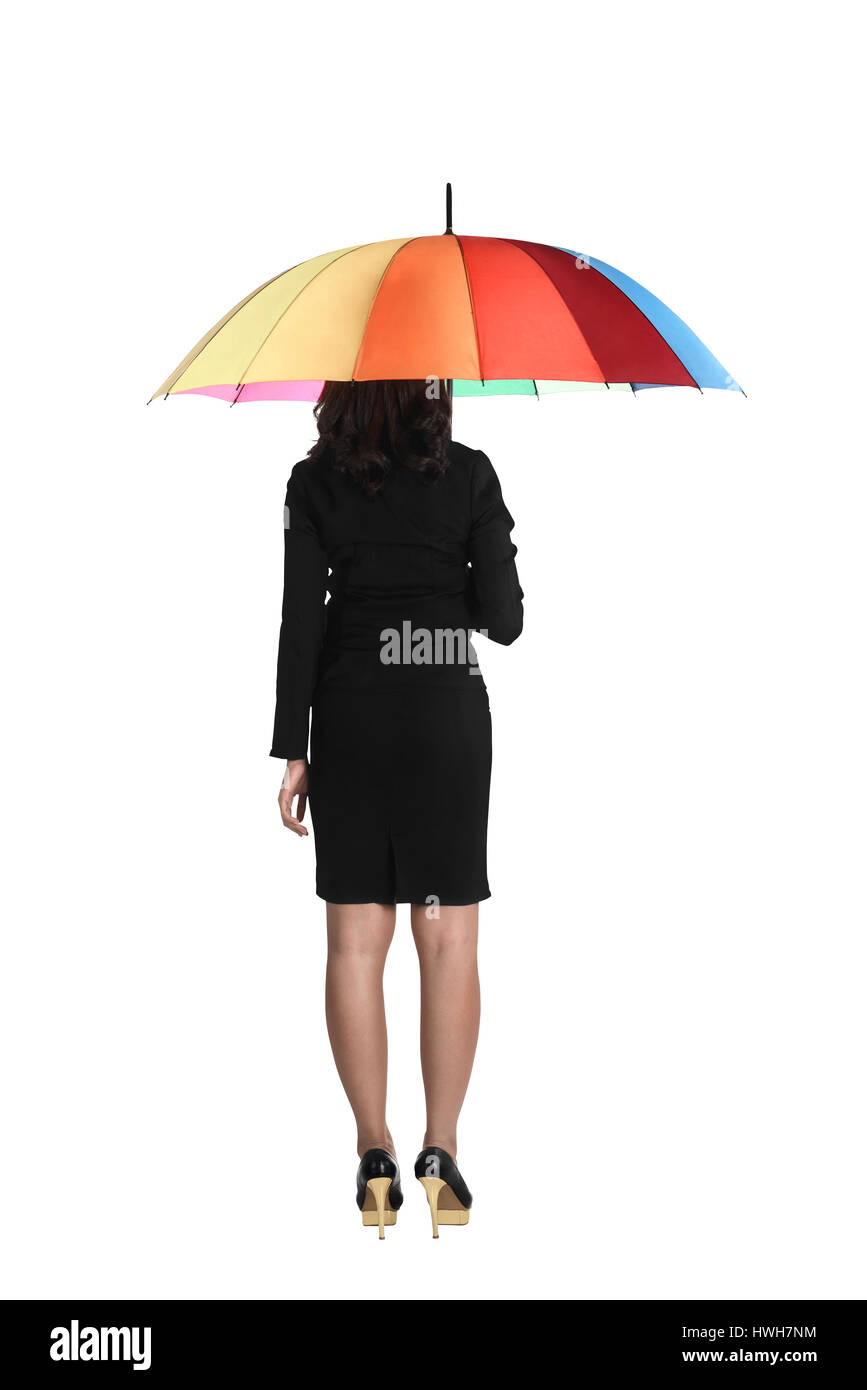 Business Woman holding ombrello coloratissimo isolate su sfondo bianco Foto Stock