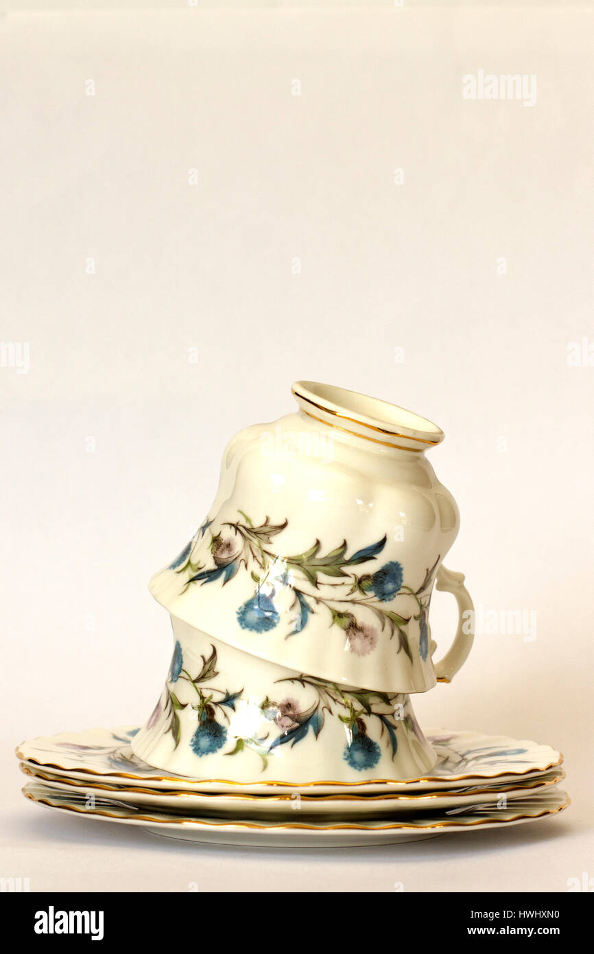 Teacups su piattini Foto Stock