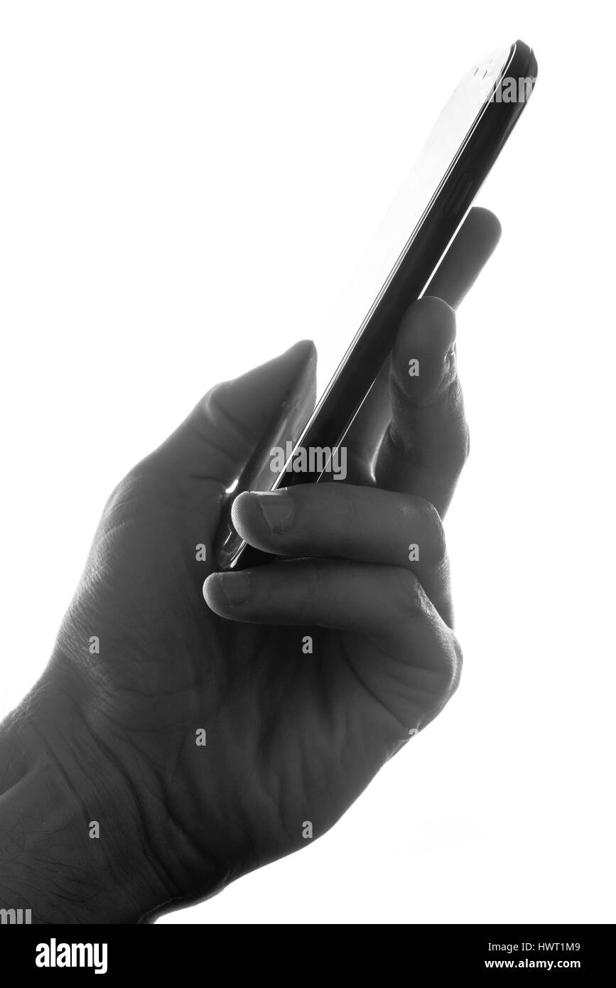 Maschio silhouette a mano tenendo il telefono cellulare su sfondo bianco Foto Stock