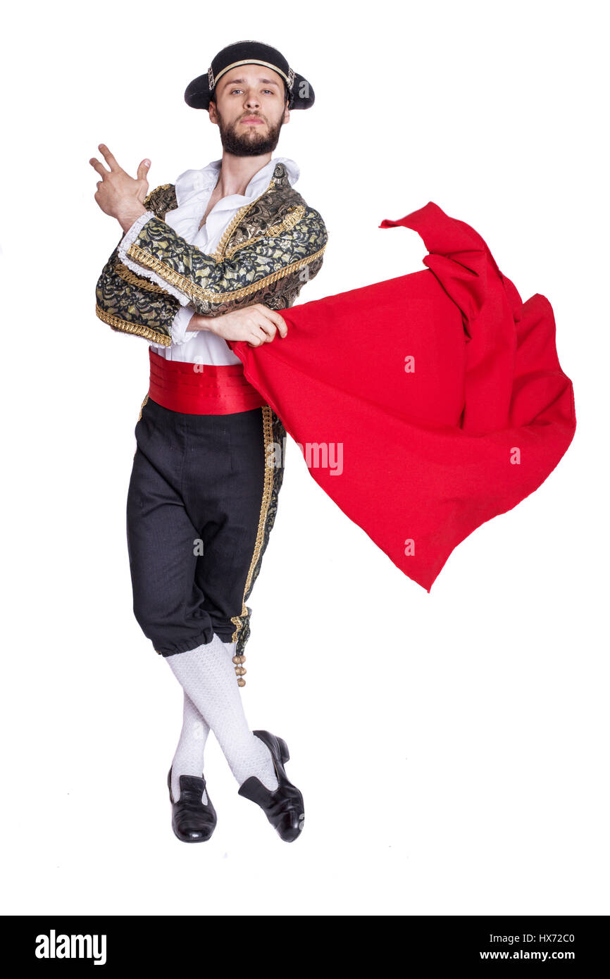 Voce maschile vestito come matador su uno sfondo bianco. Ritratto in studio Foto Stock