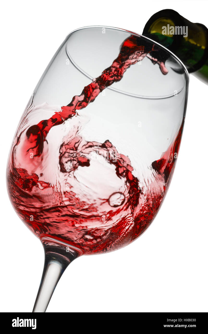 Vino rosso schizzi di bottiglia in vetro. Foto Stock