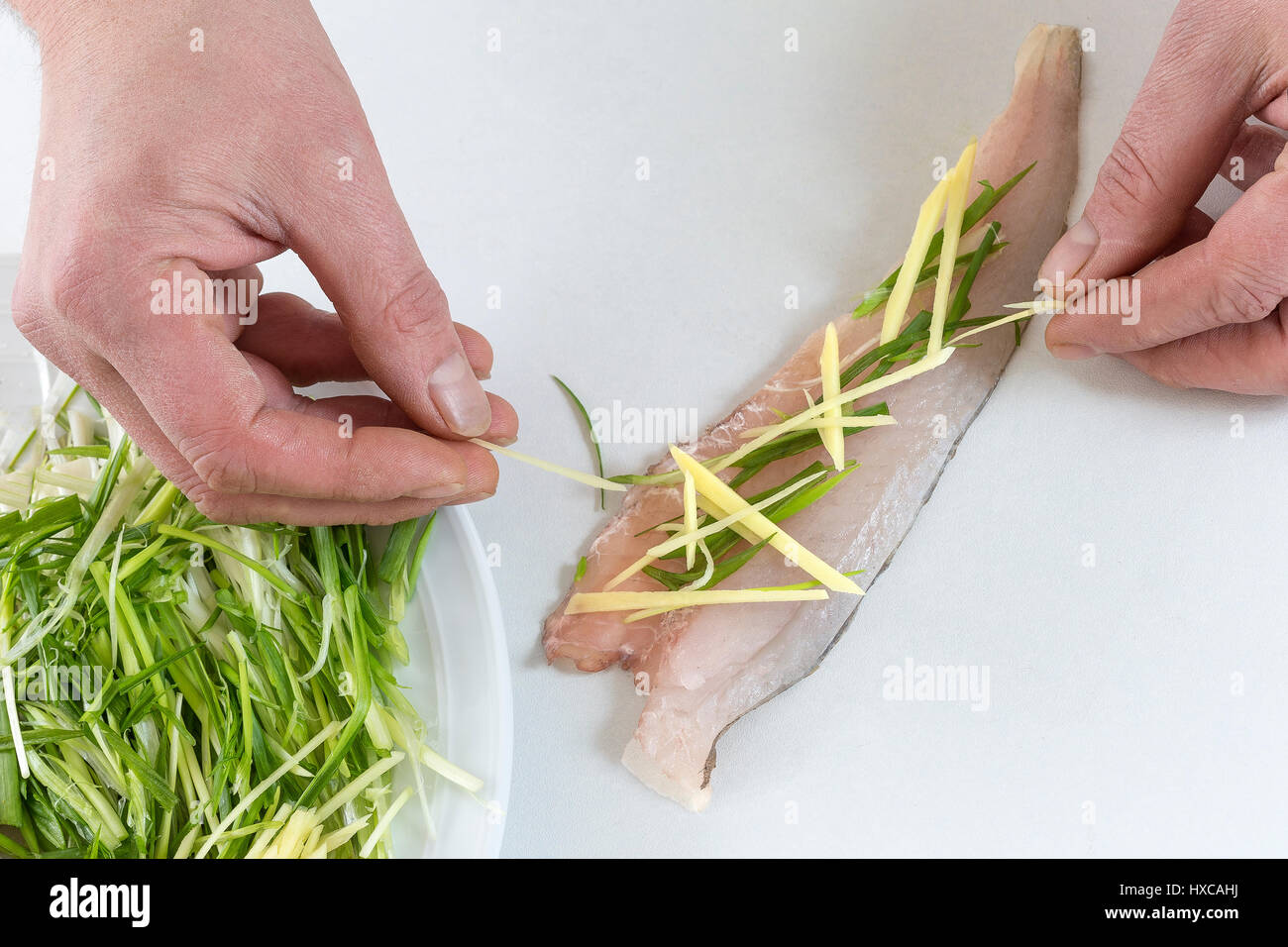 Delizioso Filetto di merlan prepareed con cives e zenzero Foto Stock