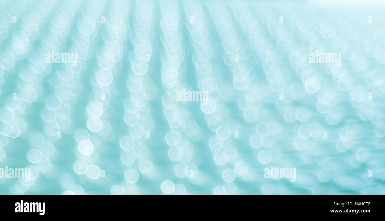 Abstract luce sfondo bokeh su sfondo blu Foto Stock