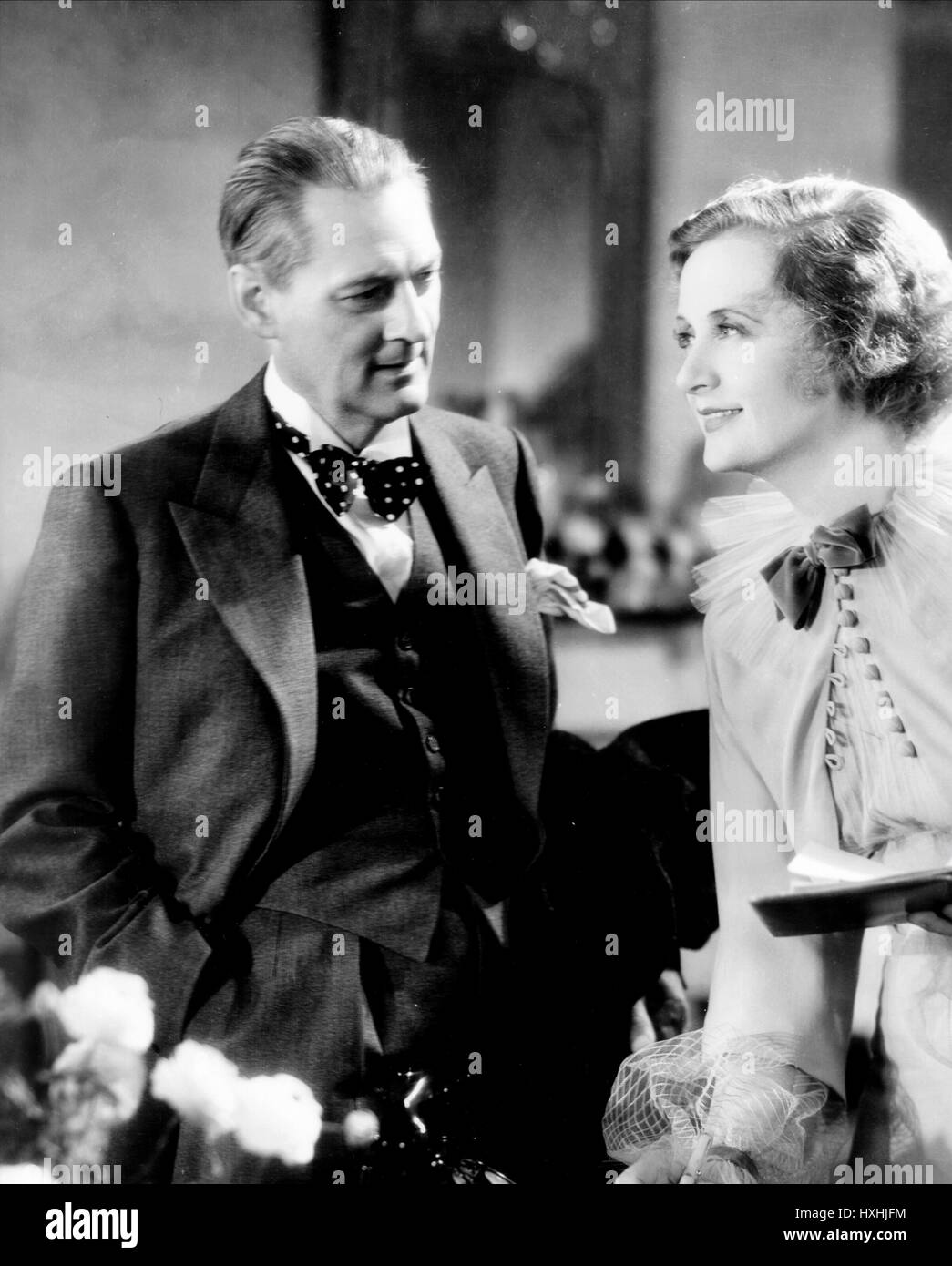 LIONEL BARRYMORE, Billie Burke, cena a otto, 1933 Foto Stock