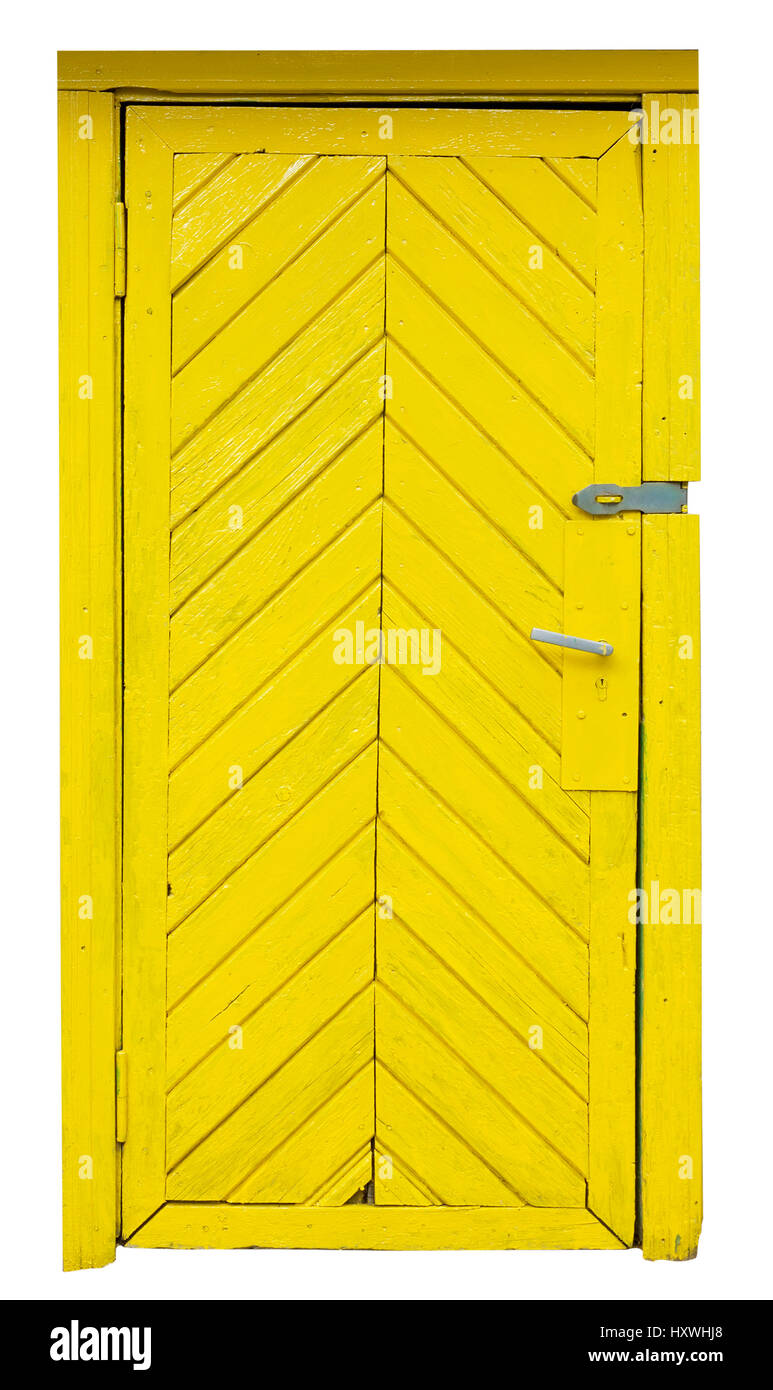 Giallo vecchia porta di legno in un mattone rustico capannone. La porta era appena verniciato vernice ywellow.isolato Foto Stock
