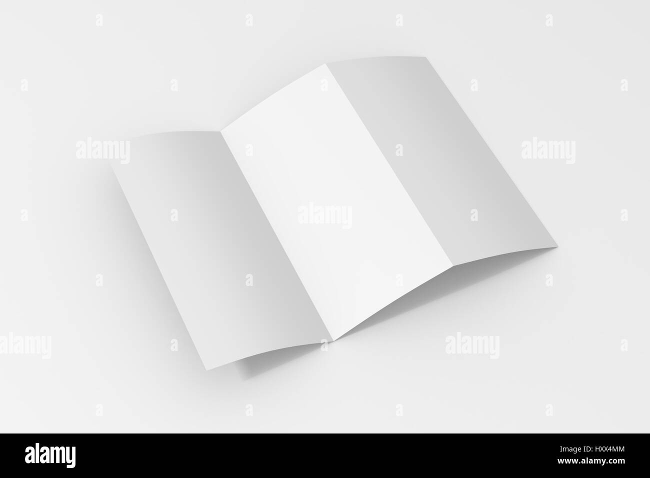 Blank trifold brochure di carta su sfondo bianco con morbide ombre e punti di luce Foto Stock