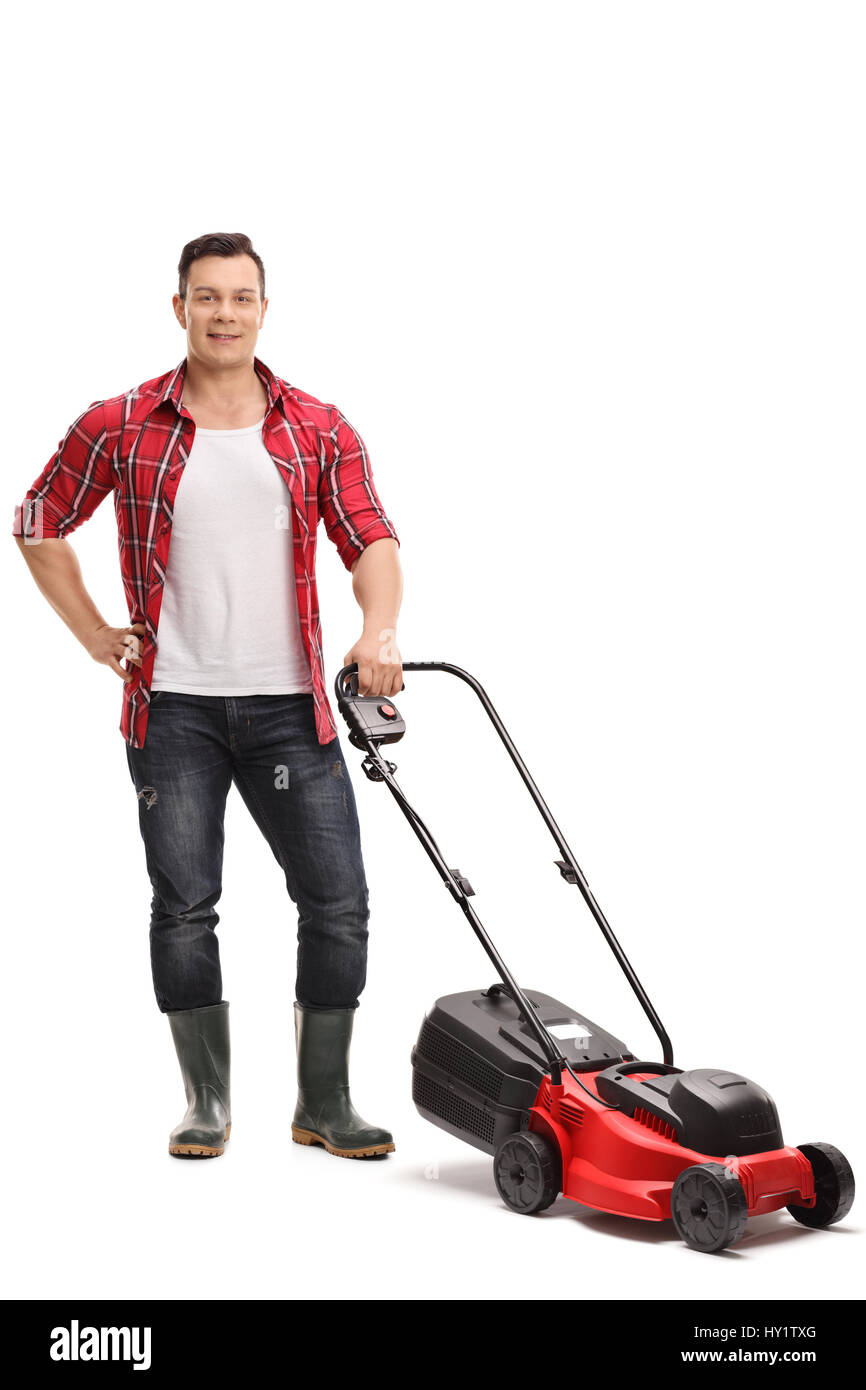A piena lunghezza Ritratto di un giardiniere maschio con un tosaerba isolati su sfondo bianco Foto Stock