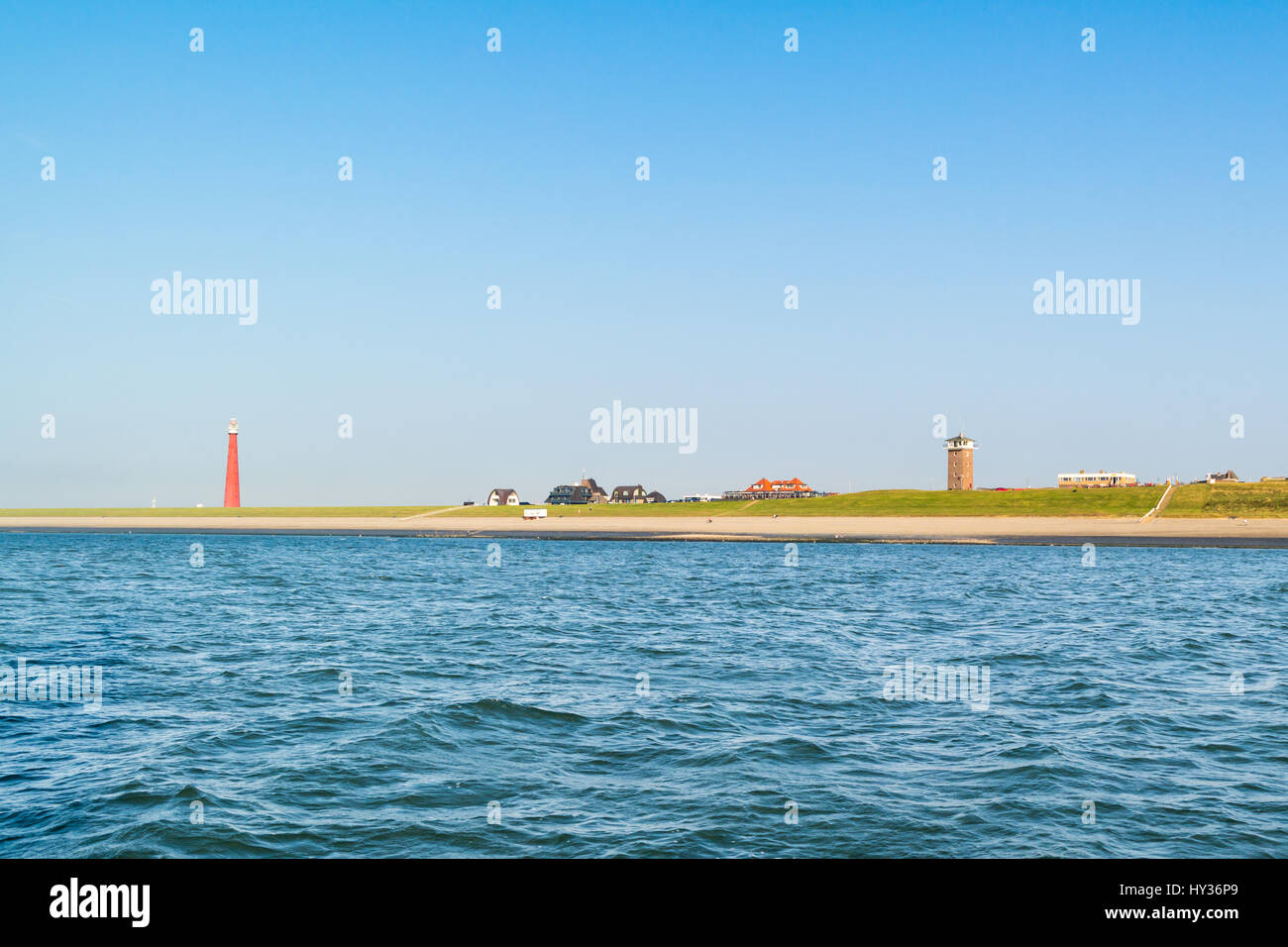 Faro Lange Jaap alla costa del Mare del Nord di Huisduinen vicino a Den Helder, Paesi Bassi Foto Stock