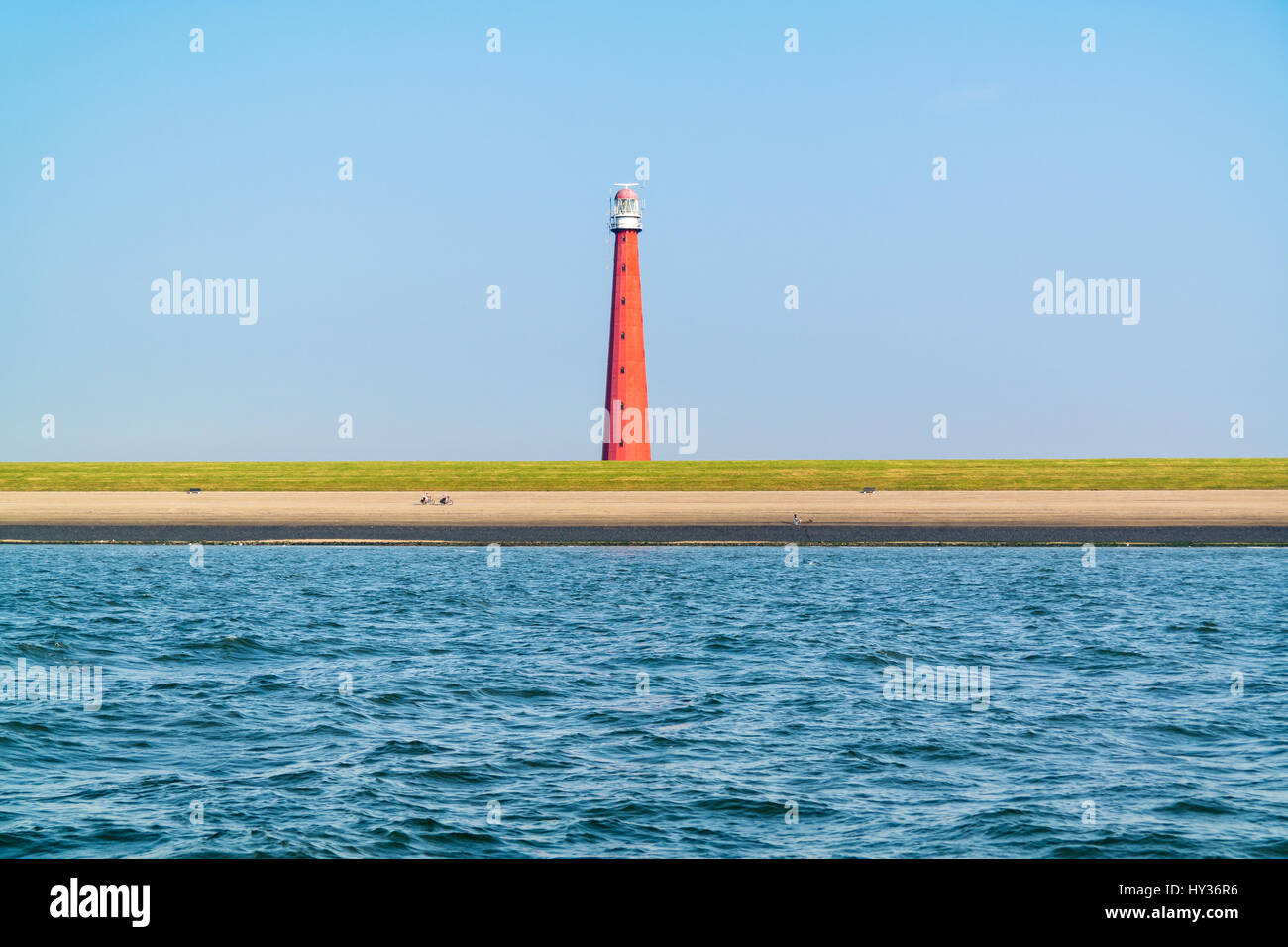 Faro Lange Jaap alla costa del Mare del Nord di Huisduinen vicino a Den Helder, Paesi Bassi Foto Stock