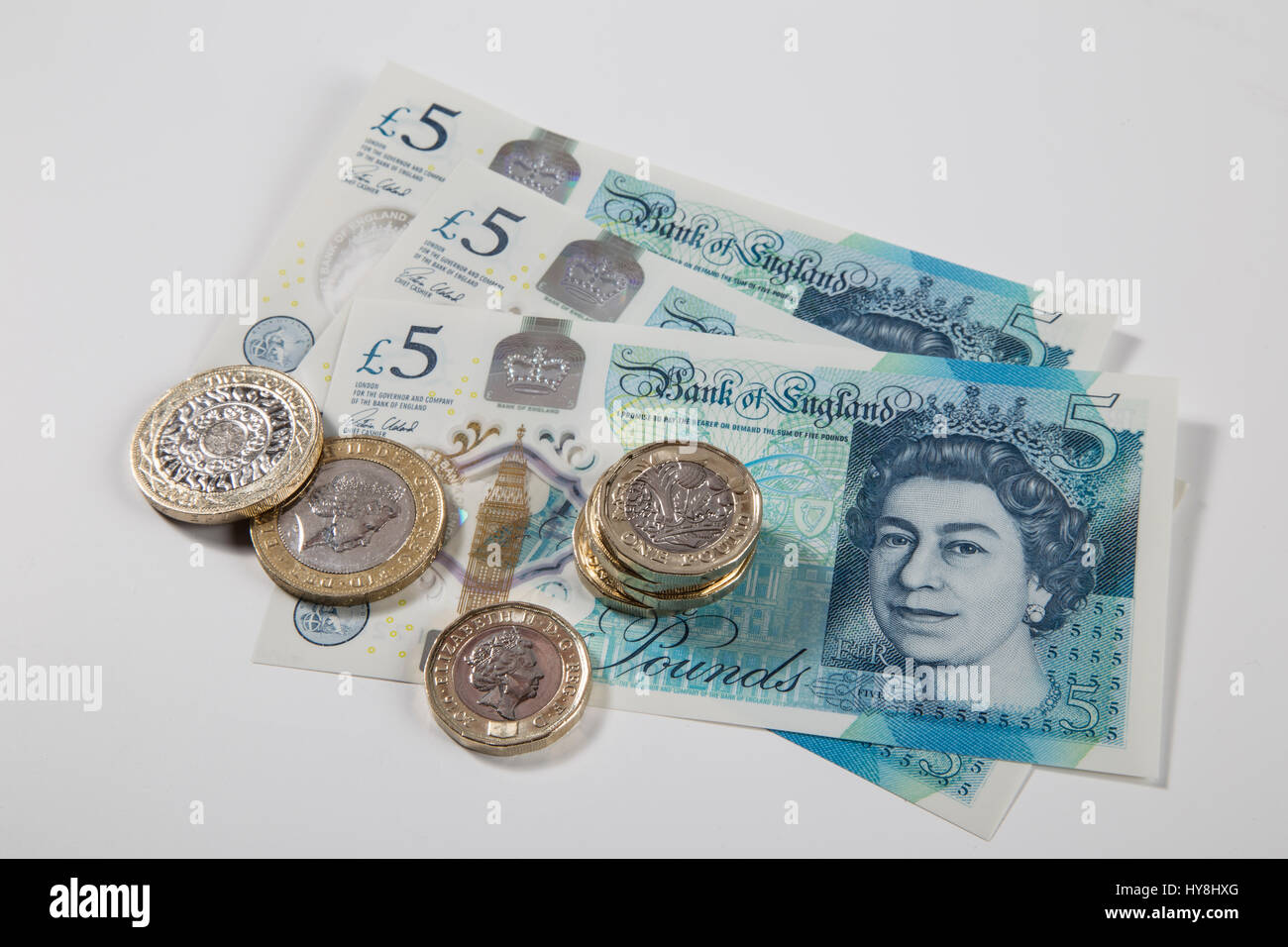 Nuovo £ 1 libbra di monete, £2 libbra di monete e di £ 5 pound note Foto Stock