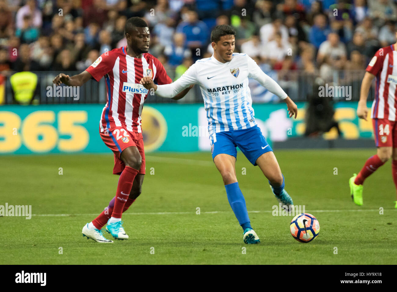 Malaga, Spagna. 1 Aprile, 2017. Thomas in azione con la palla. La Liga Santander match day 29 gioco tra Malaga CF e Atletico de Marid giocato in La Rosaleda stadio, Malaga, Spagna. Atletico sconfitto Malaga 0-2 con gol di Koke (26 min) e Filipe Luis (74 min). Foto di Fran Santiago | PHOTO MEDIA EXPRESS Credit: VWPics/Alamy Live News Foto Stock