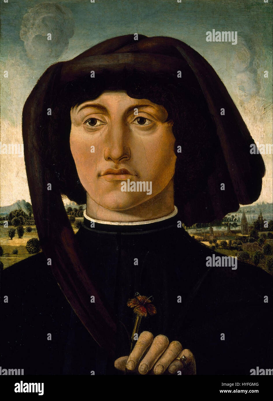 Questo ritratto, attribuito a un ignoto artista italiano, raffigura un giovane che tiene in mano un fiore rosa. Probabilmente dipinta nel periodo rinascimentale o barocco, l'opera d'arte è un esempio dell'enfasi dell'epoca sulla ritrattistica, con attenzione ai dettagli e agli elementi simbolici. Foto Stock