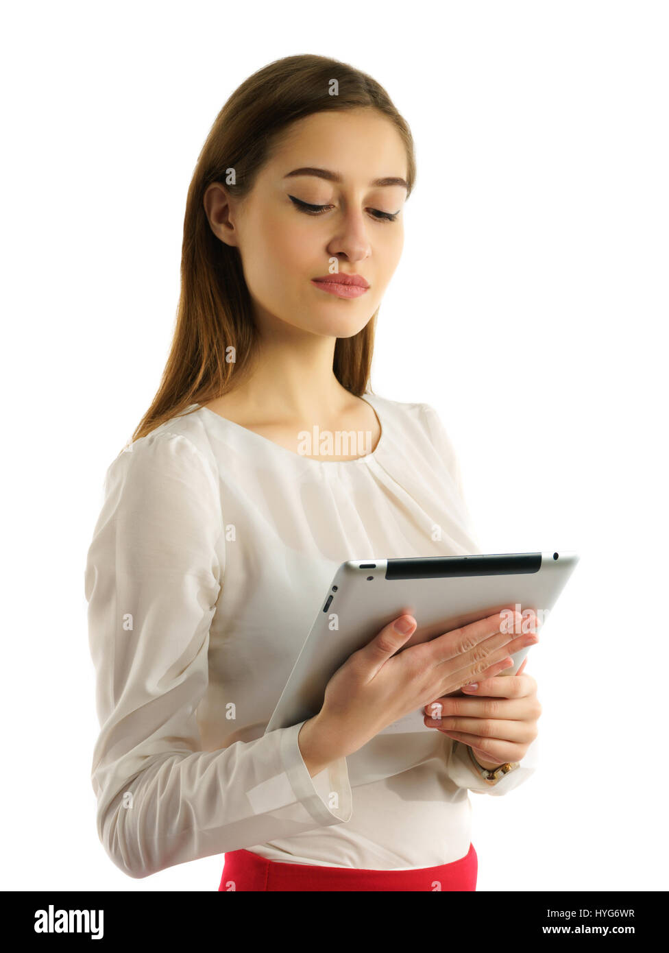Studente Surious ragazza utilizzando tablet pc isolato su bianco Foto Stock