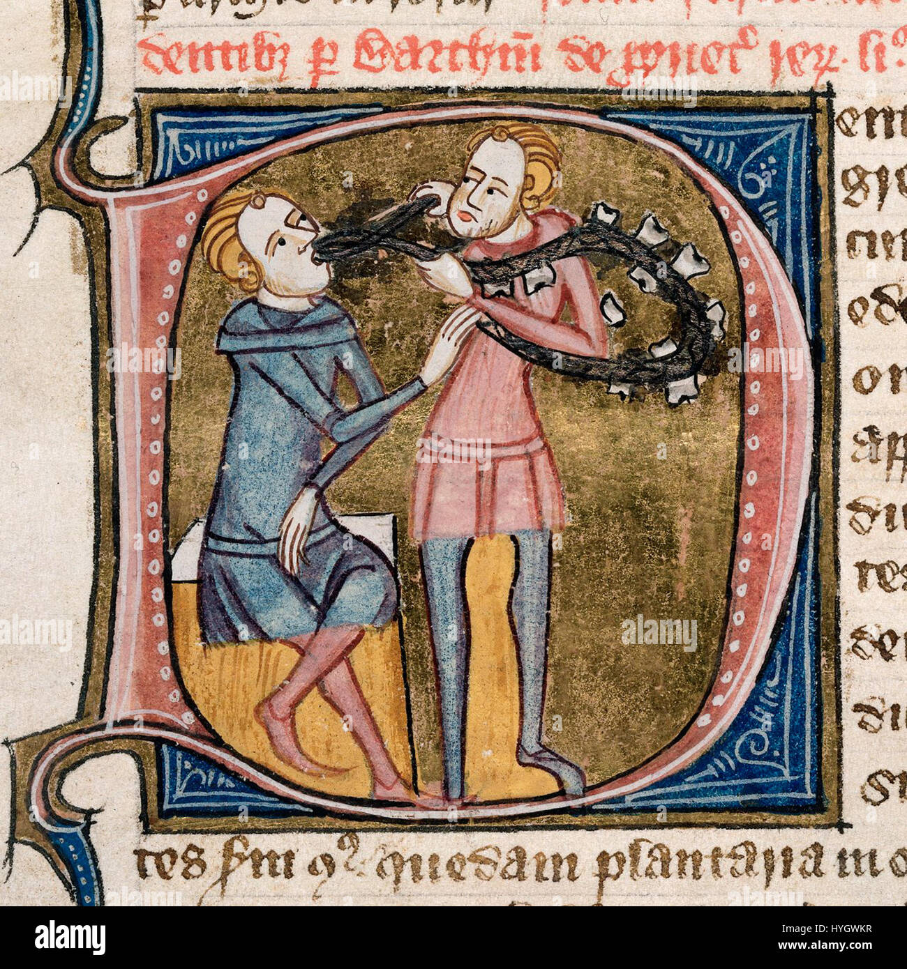 Un'illustrazione medievale dipinta di due figure, una che tiene un oggetto simile a un serpente intorno al collo dell'altra, circondata da bordi decorativi e testo. Foto Stock