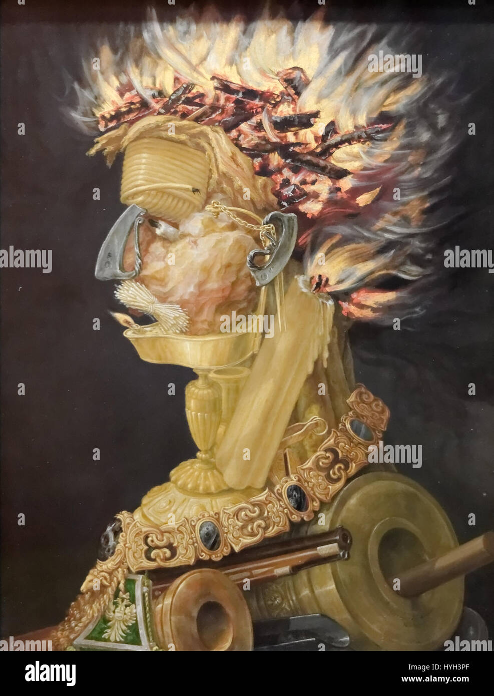 Il "fuoco" di Giuseppe Arcimboldo fa parte della sua famosa serie di ritratti realizzati con oggetti naturali. Questa opera combina elementi legati al fuoco, come fiamme e brace, in un ritratto, che mostra l'approccio innovativo di Arcimboldo alla ritrattistica e il suo uso simbolico della natura. Foto Stock