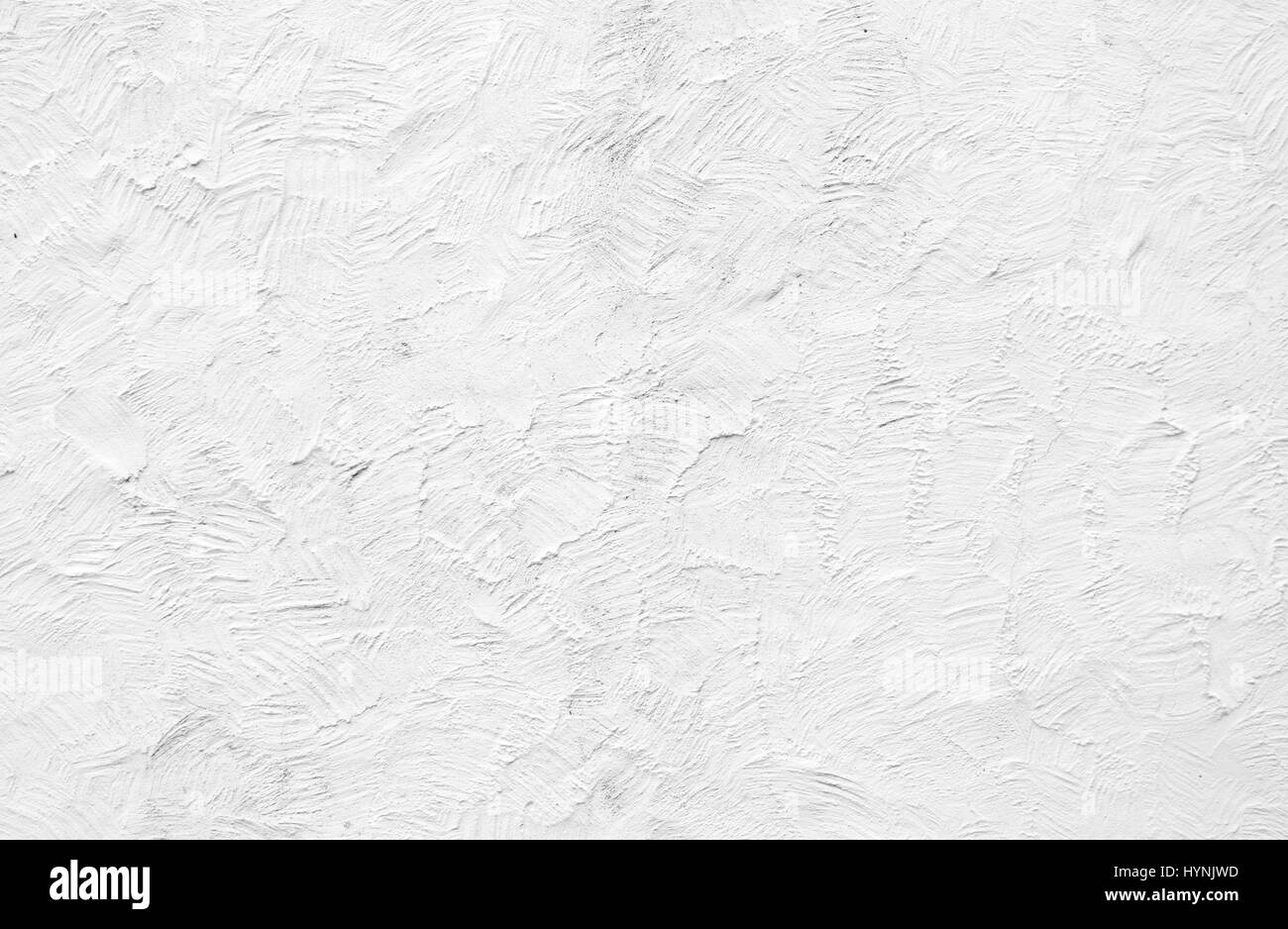 Ruvida dipinte di bianco il rendering su parete esterna Foto Stock