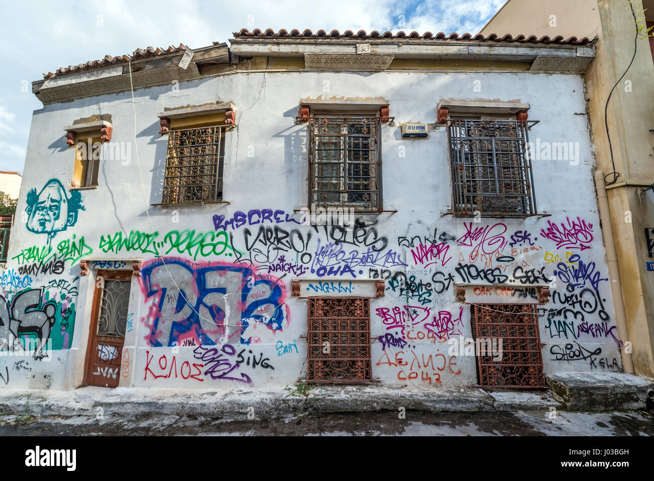 I graffiti sulla parete in Plaka storico quartiere nella città di Atene, Grecia Foto Stock