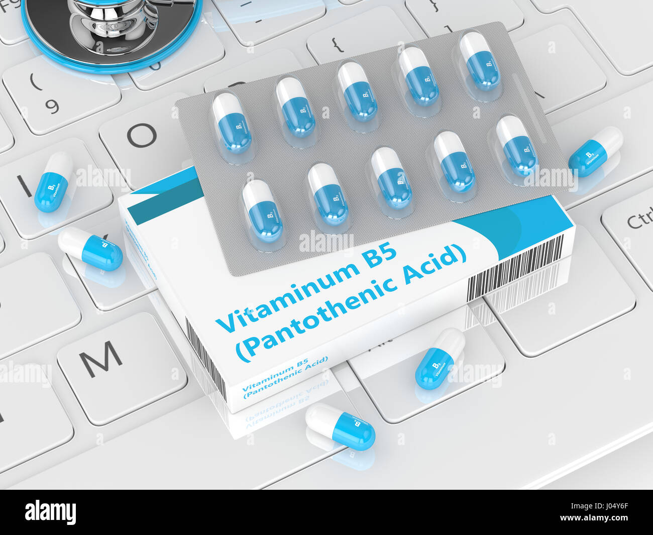 3D rendering di vitamina B5 pillole giacente sulla tastiera del computer Foto Stock