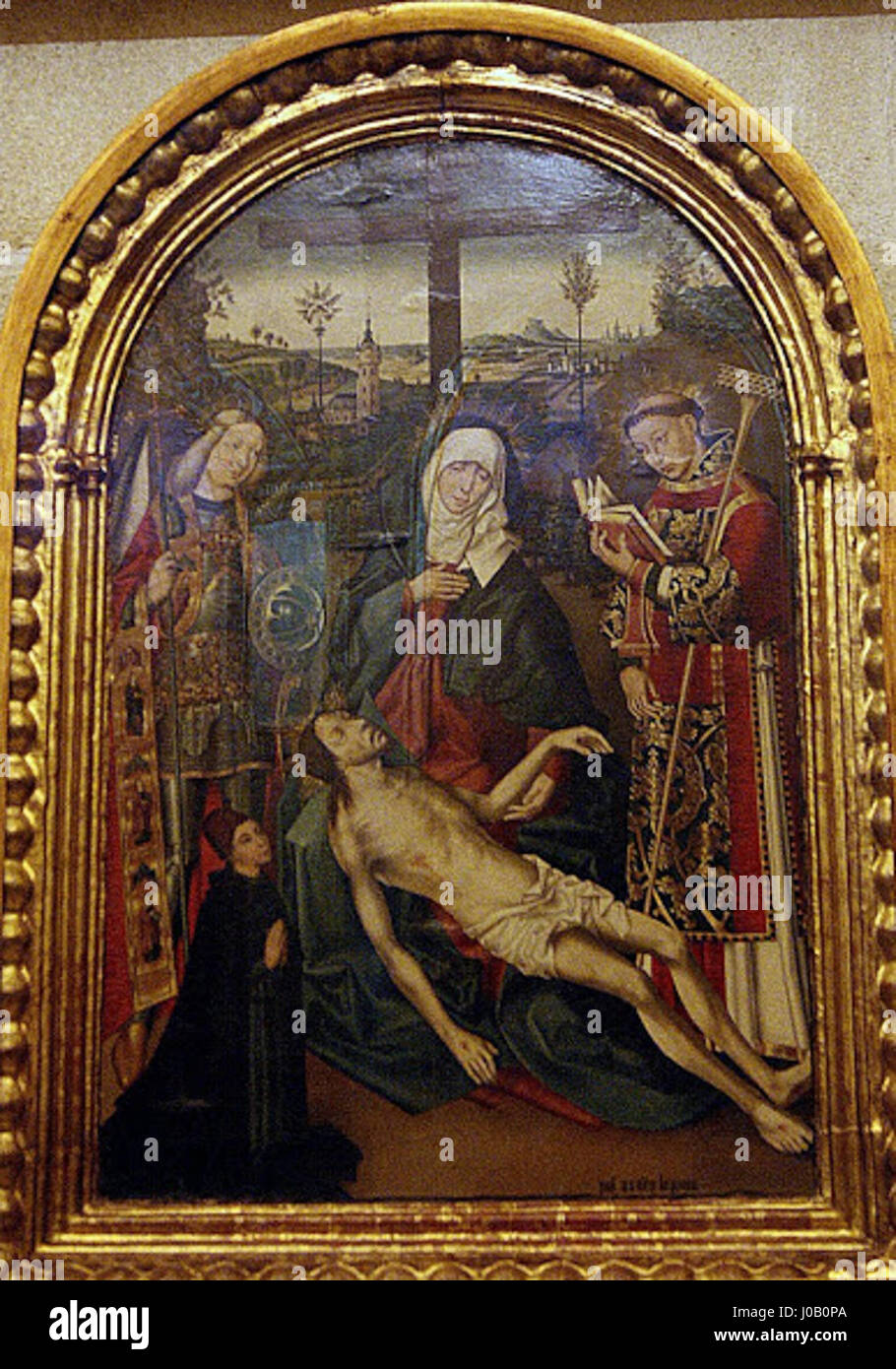 "Pietà con San Vincenzo, San Michele e un donatore" di Juan Núñez, ospitato nella cattedrale di Siviglia. Il dipinto raffigura la Vergine Maria che regge il corpo senza vita di Gesù, affiancato da San Vincenzo e San Michele, con una figura donatrice che presenta l'opera. Foto Stock