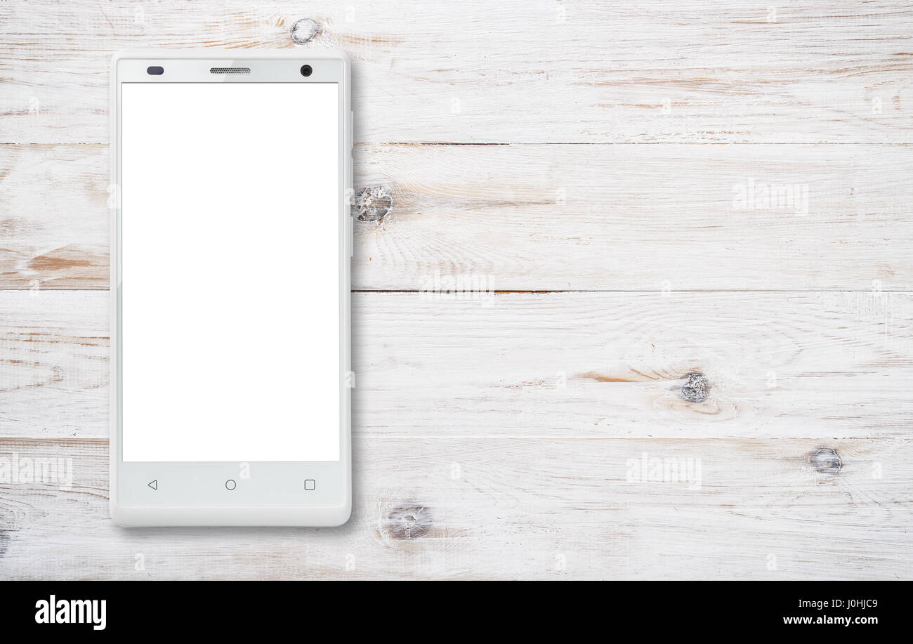 Vista superiore della moderna smartphone con schermo bianco su sfondo di legno Foto Stock