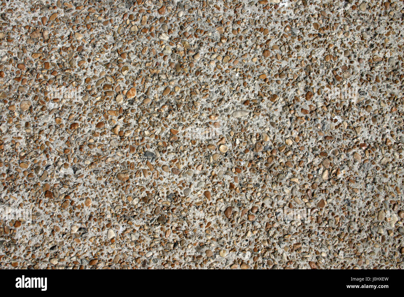 Una superficie pebbledash Foto Stock