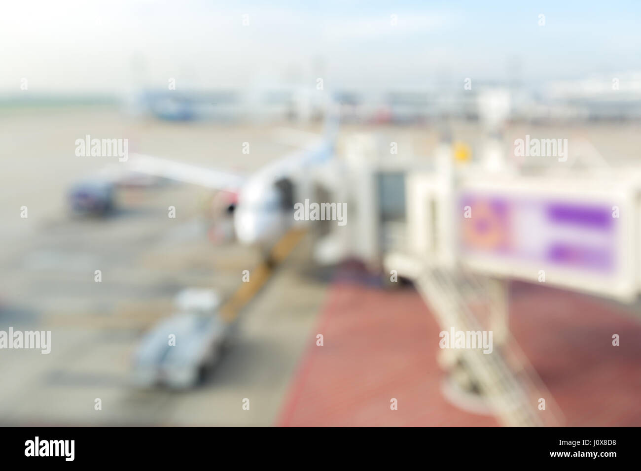 Sfocare lo sfondo di aeroporto jetway Foto Stock