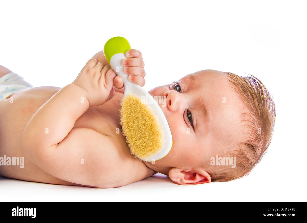 Bambino con spazzola per capelli Foto Stock