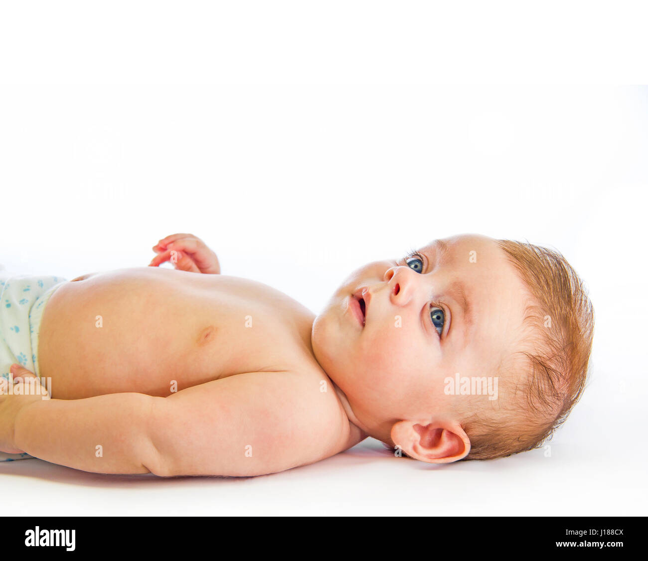 Giacente baby cercando Foto Stock