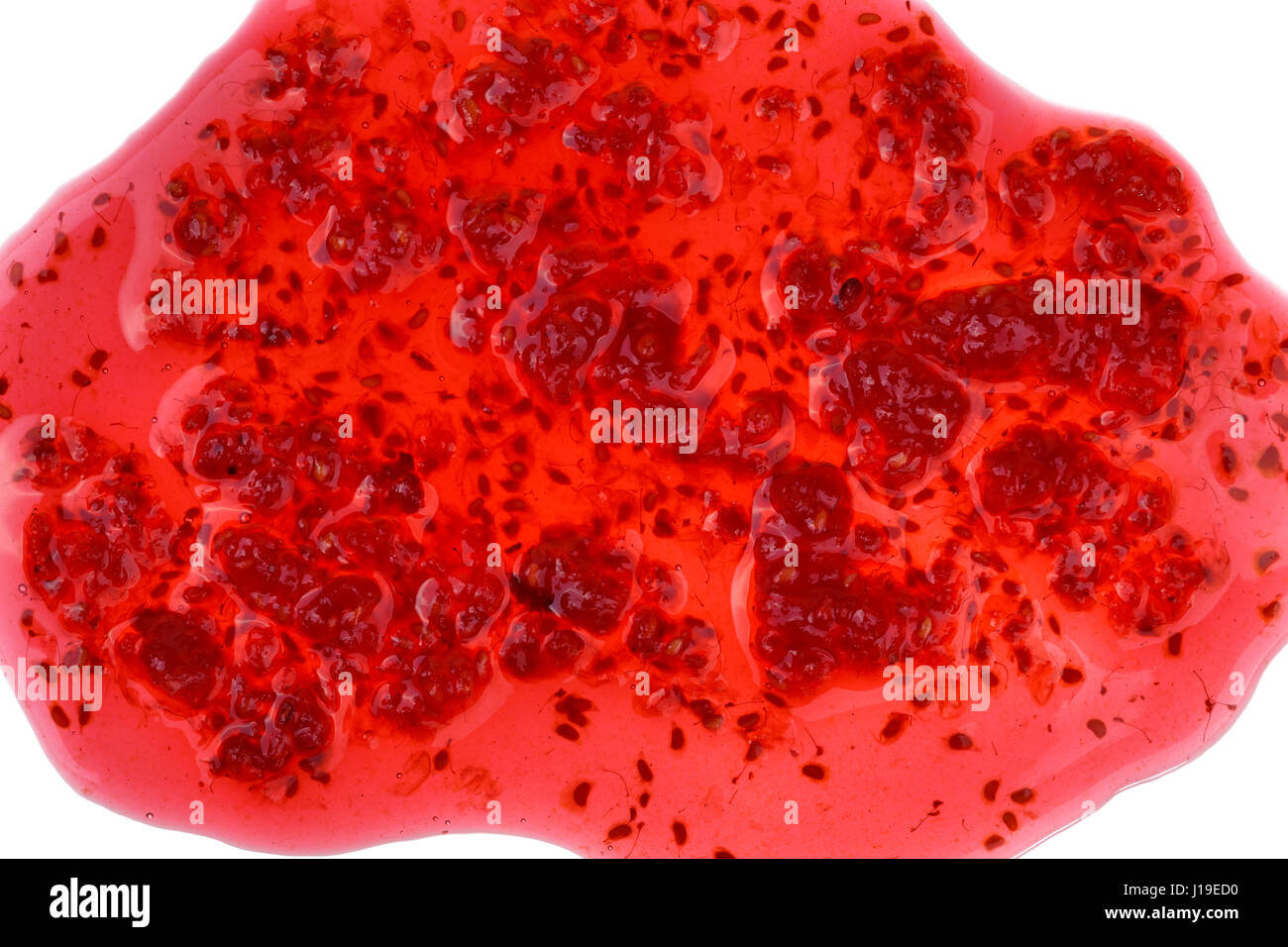 Macro shot di fuoriuscite di confettura di lamponi Foto Stock