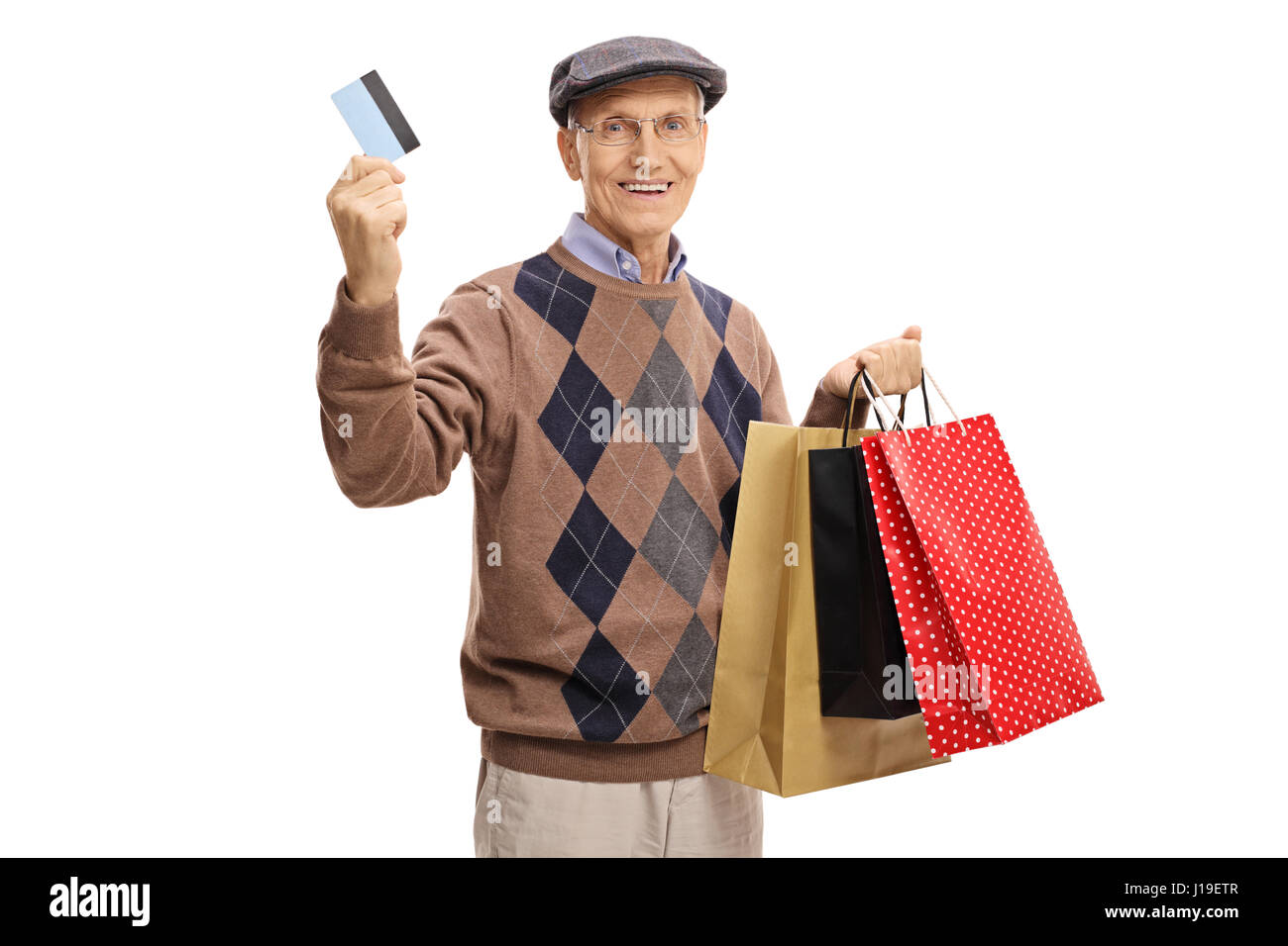 Uomo maturo con una carta di credito e shopping bags isolati su sfondo bianco Foto Stock